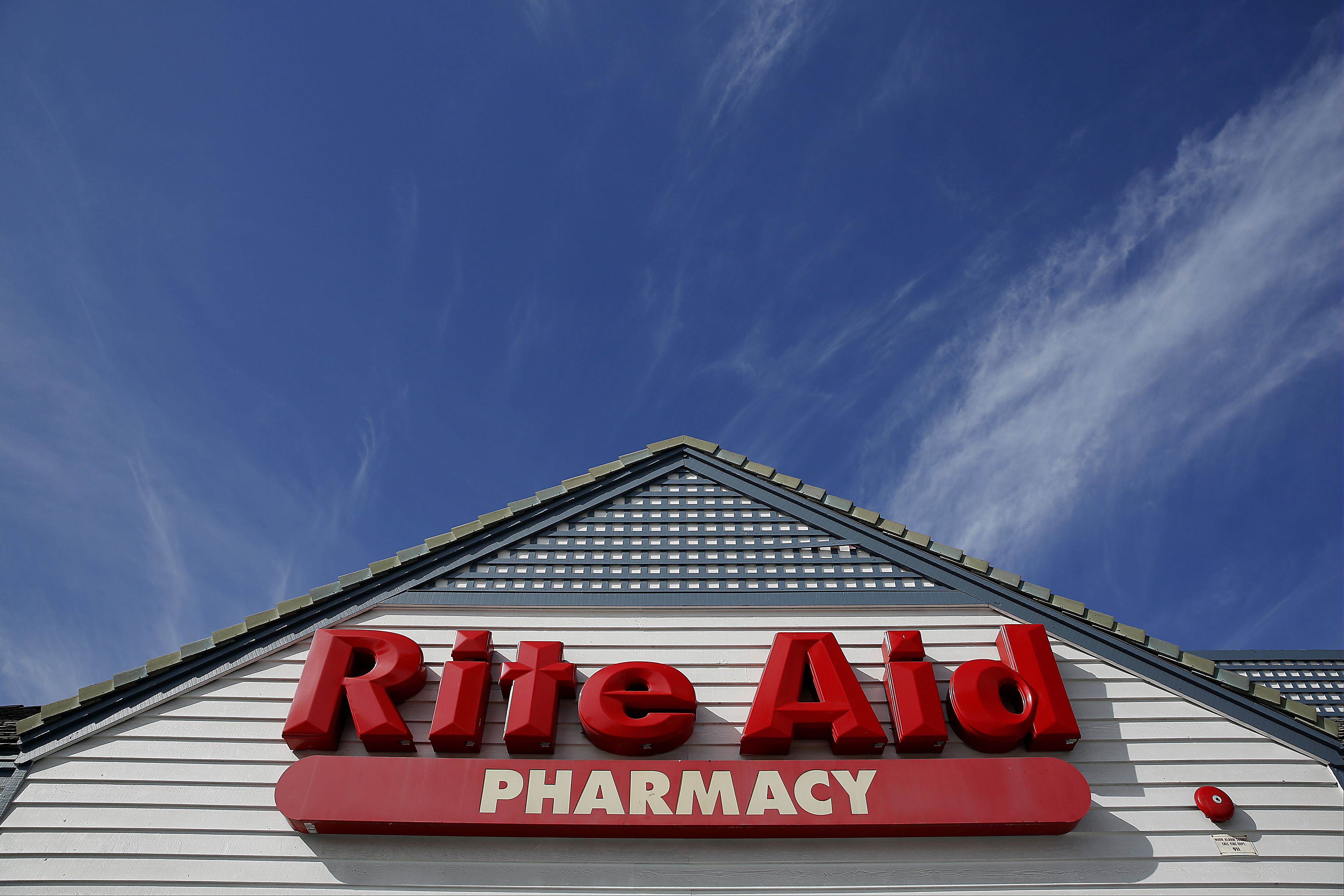 Signage is displayed outside of a Rite Aid Corp. store in Redondo Beach, California, U.S., on Wednesday, April 9, 2014. Photographer: Patrick T. Fallon/Bloomberg