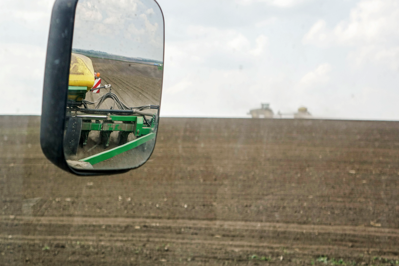 A farmer sows a field of corn seeds in the countryside outside Ternopil, Ukraine, on Friday, May 2, 2014.