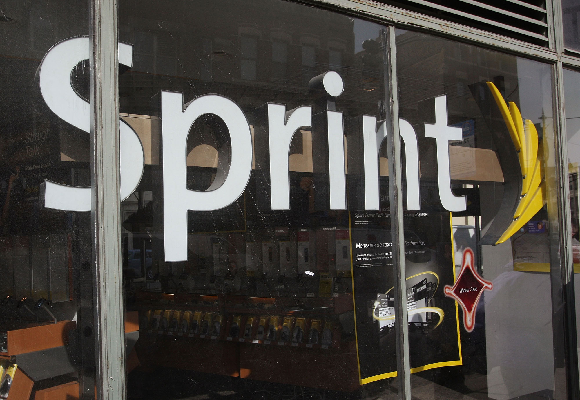 Sprint added mobile subscribers but still needs to slash its expenses.