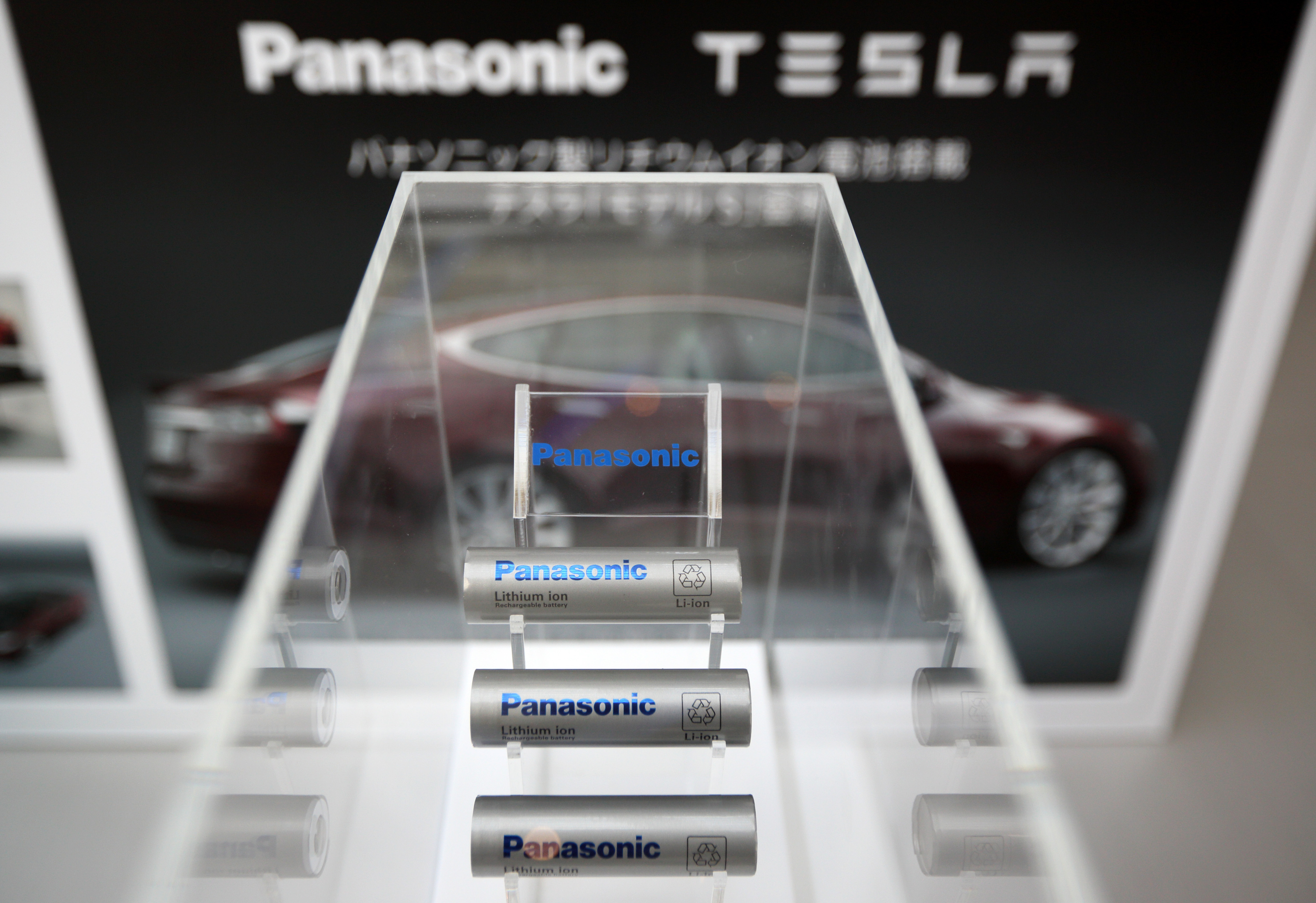 Panasonic Corp. lithium-ion batteries manufactured for Tesla Motors Inc. Model S electric vehicles are displayed at Panasonic Center Tokyo in Tokyo, Japan, on Tuesday, Nov. 19, 2013. Panasonic won a contract to supply cells to Tesla's electric vehicles in a deal that may generate $7 billion in revenue. Photographer: Tomohiro Ohsumi/Bloomberg via Getty Images