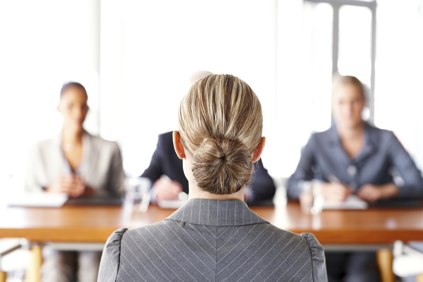 When sitting through a negative performance evaluation, should you defend yourself or smile and nod?