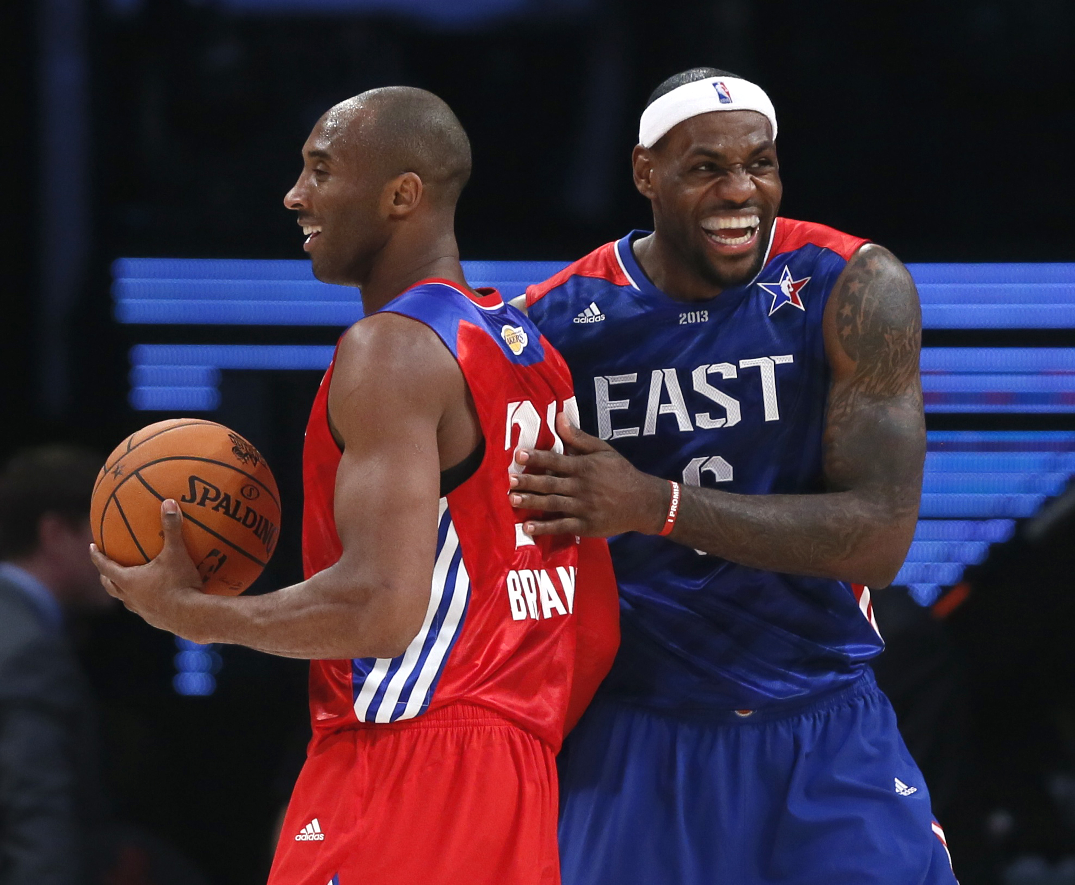 NBA All-Star Bryant of the Lakers and All-Star James of the Heat share a laugh during the NBA All-Star basketball game in Houston