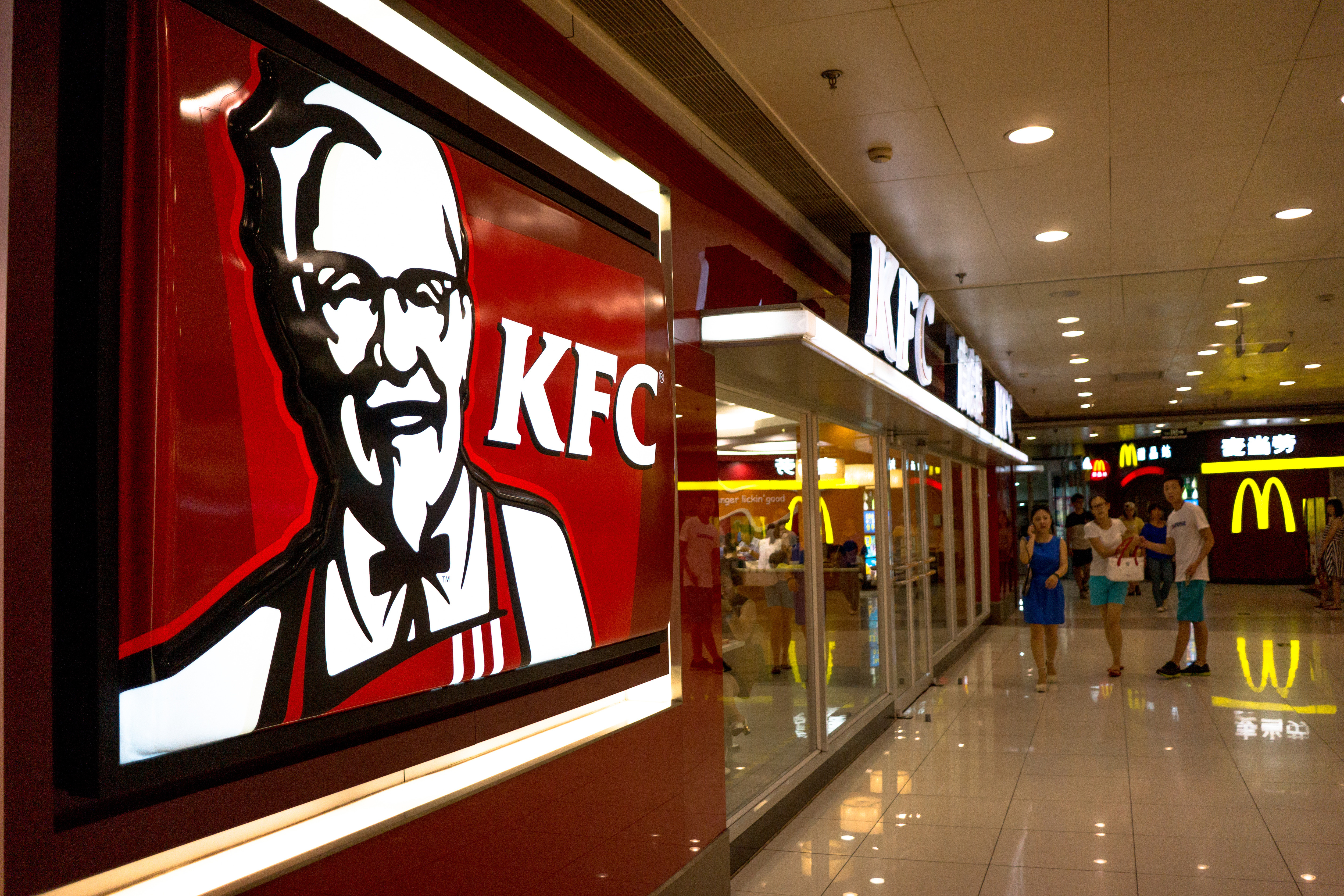A KFC restaurant in a shopping mall. KFC, McDonalds,