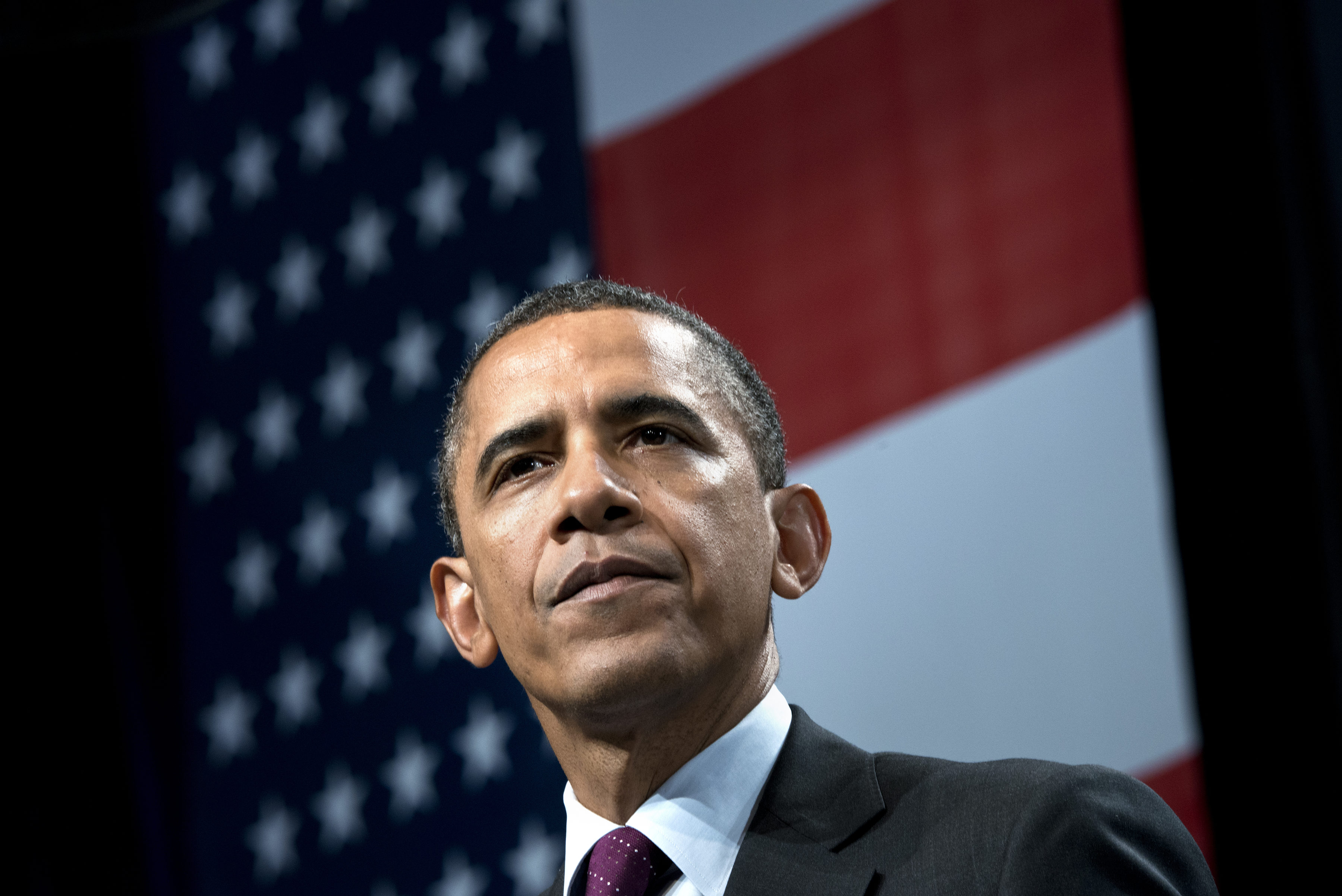 US President Barack Obama pauses while s
