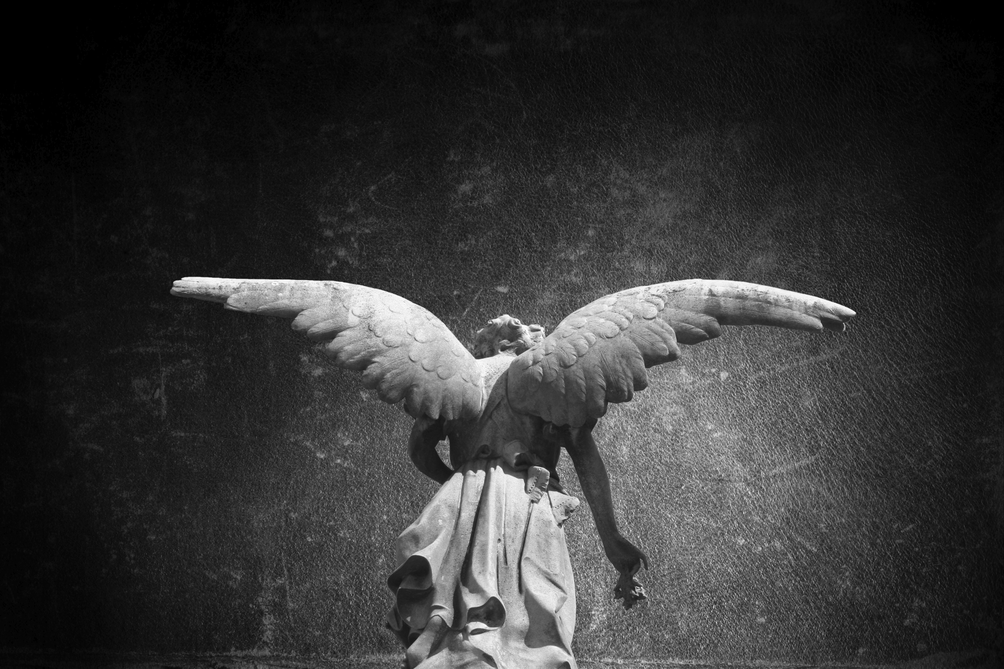Angel sculpture in the Recoleta public cemetery in Buenos Aires, Argentina.