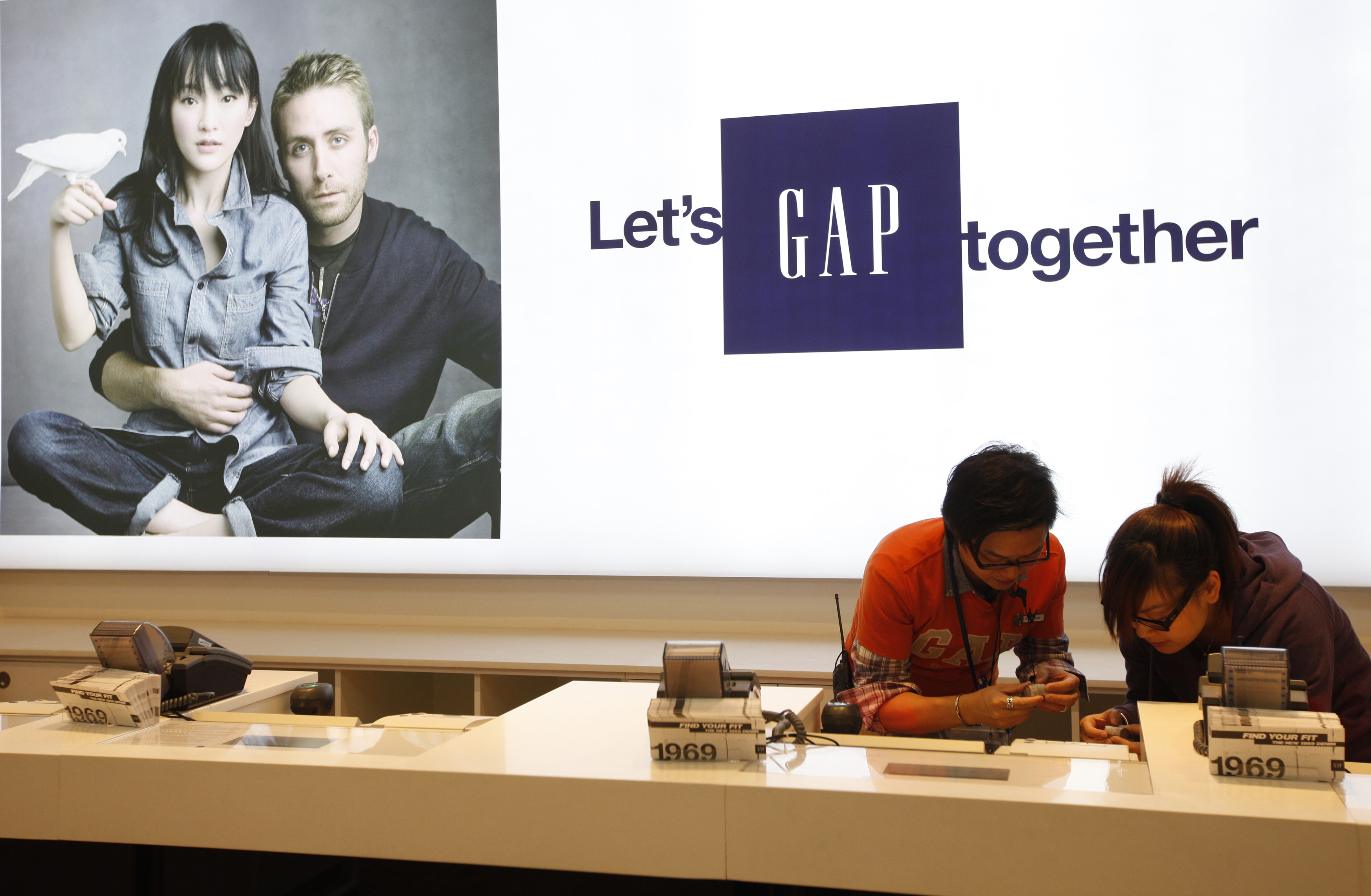 Gap sales assistants make last minute preparation at Hong Kong's first Gap Store before its opening in the financial Central district