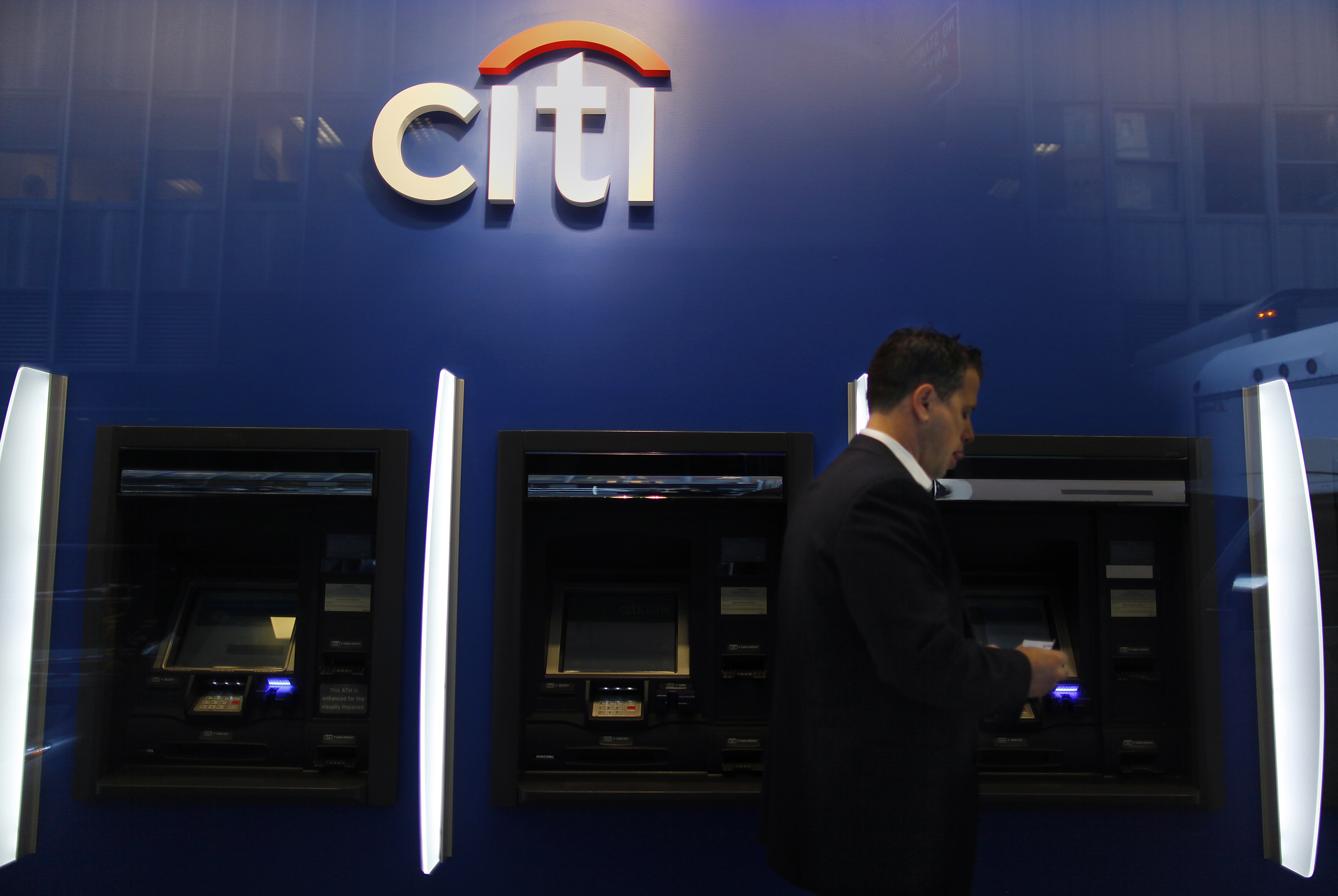 A man walks past a Citibank branch in lower Manhattan, New York