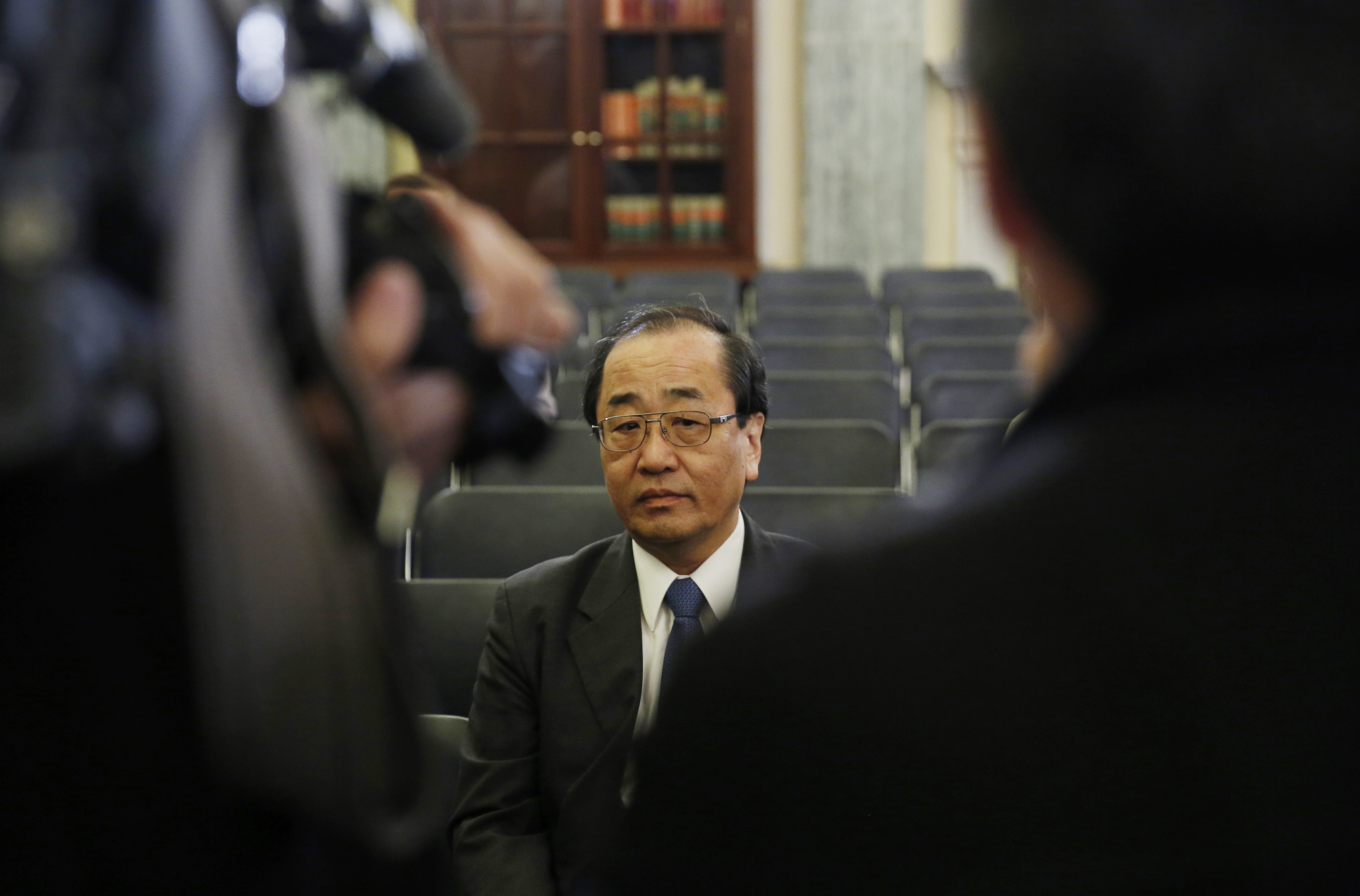 Takata airbag official Shimizu waits to testify on defective airbags at Senate Commerce Science and Transportation Committee hearing in Washington