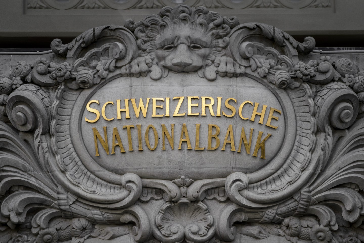 As the Fed inches toward rate hike, Switzerland goes negative