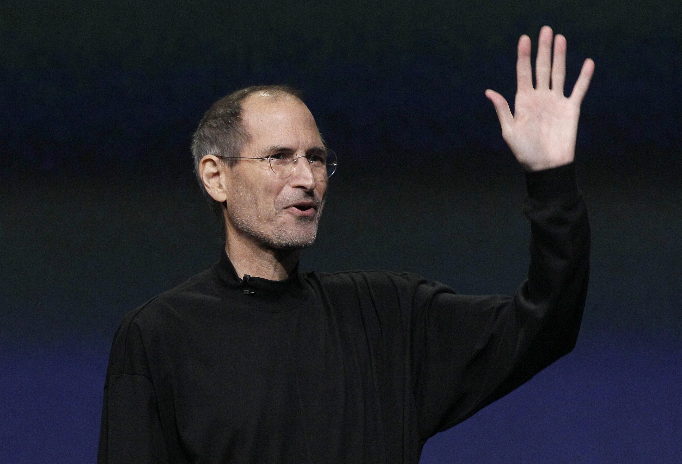 Apple Inc. Chairman and CEO Steve Jobs waves to his audience at an Apple event at the Yerba Buena Center for the Arts Theater in San Francisco, Wednesday, March 2, 2011. (AP Photo/Jeff Chiu)