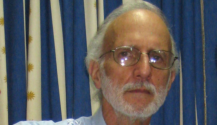 In this photo released by Finlay Military Hospital, jailed American Alan Gross, center, holds a sign as he poses for a photo with Rabbi Elie Abadie, right, and U.S. lawyer James L.Berenthal at the Finlay military hospital in Havana, Cuba, Tuesday, Nov. 27, 2012. Gross was imprisoned in December 2009. At the time he was working as a subcontractor on a democracy-building project funded by the U.S. Agency for International Development. (AP Photo/Finlay Military Hospital)