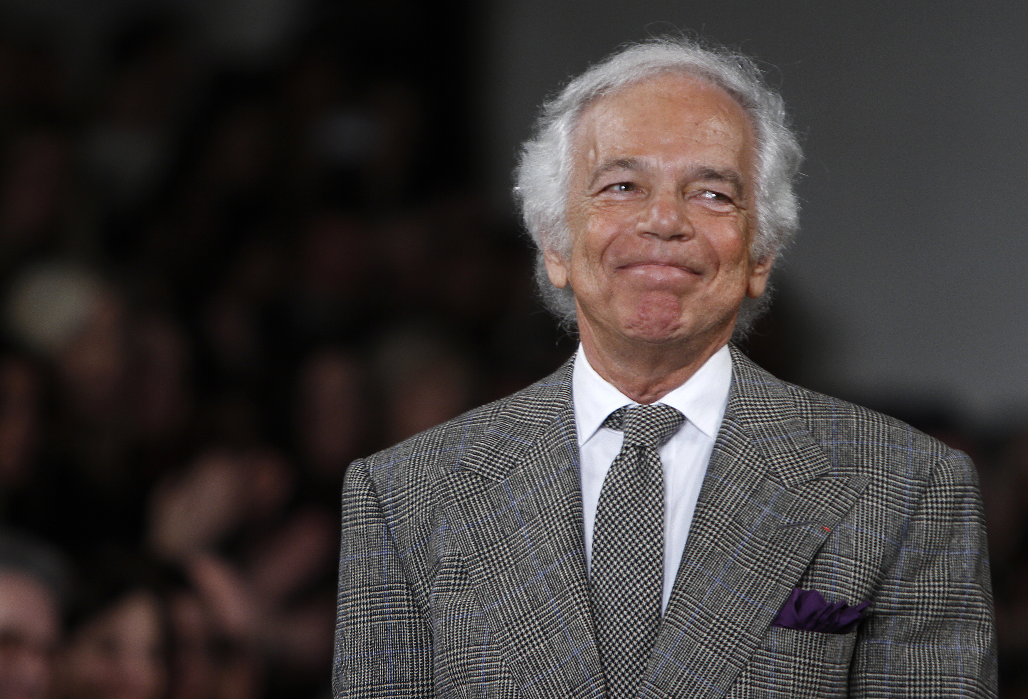Designer Ralph Lauren acknowledges the crowd following the Fall/Winter 2012 collection during New York