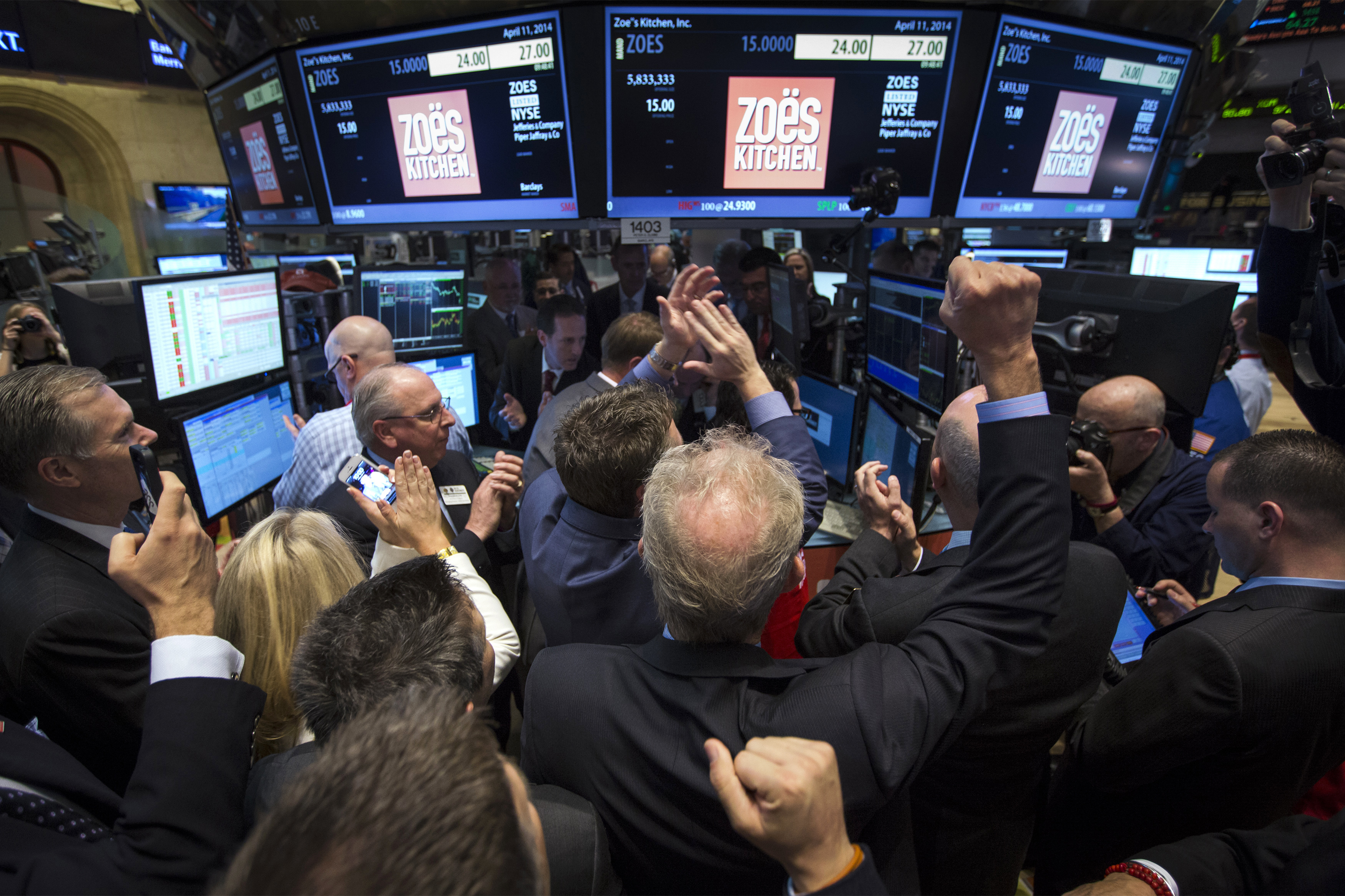 Traders, investors and guests celebrate as Zoe's Kitchen begins trading following the company's IPO at the NYSE