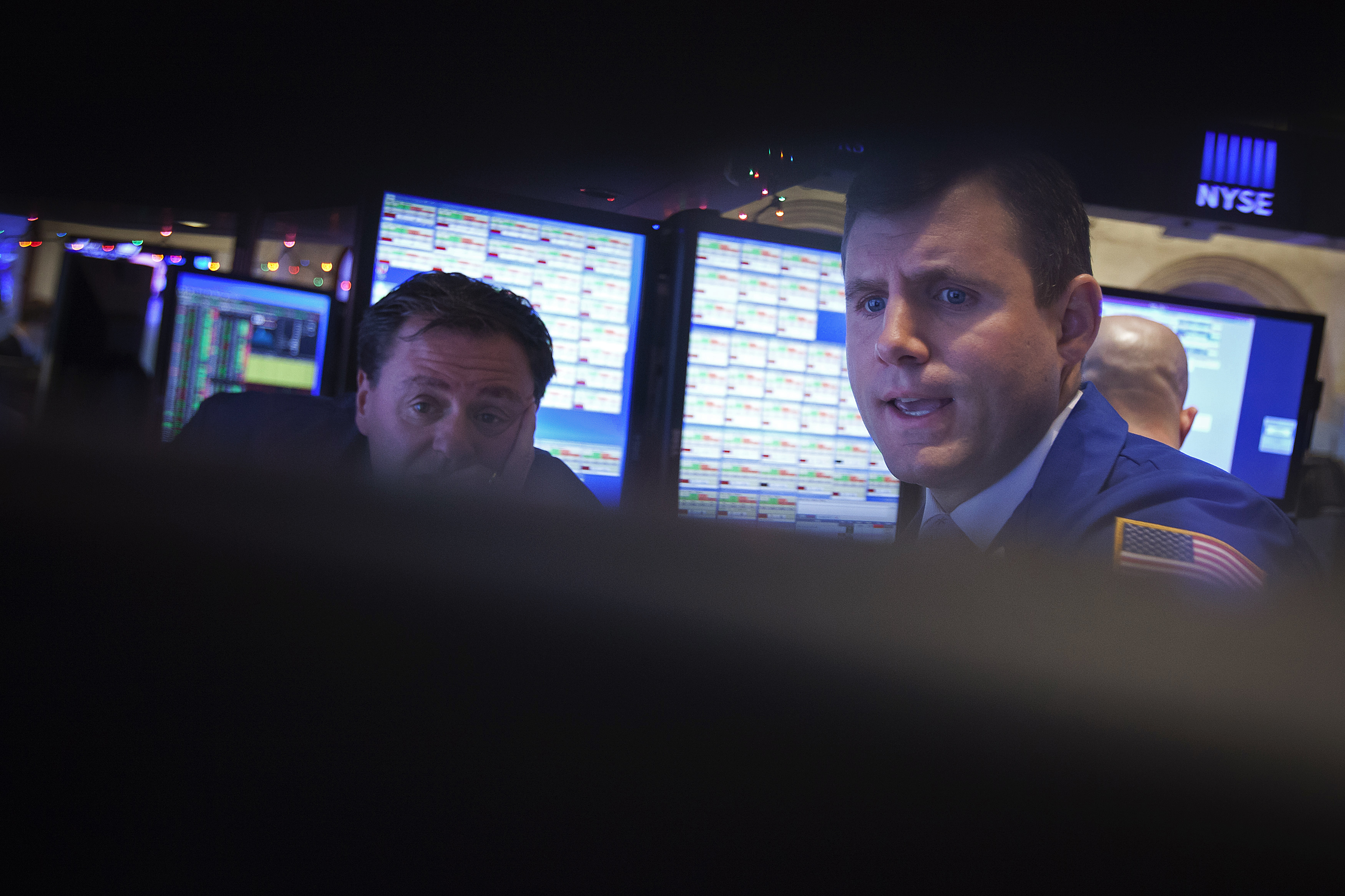 Traders work on the floor of the NYSE in New York