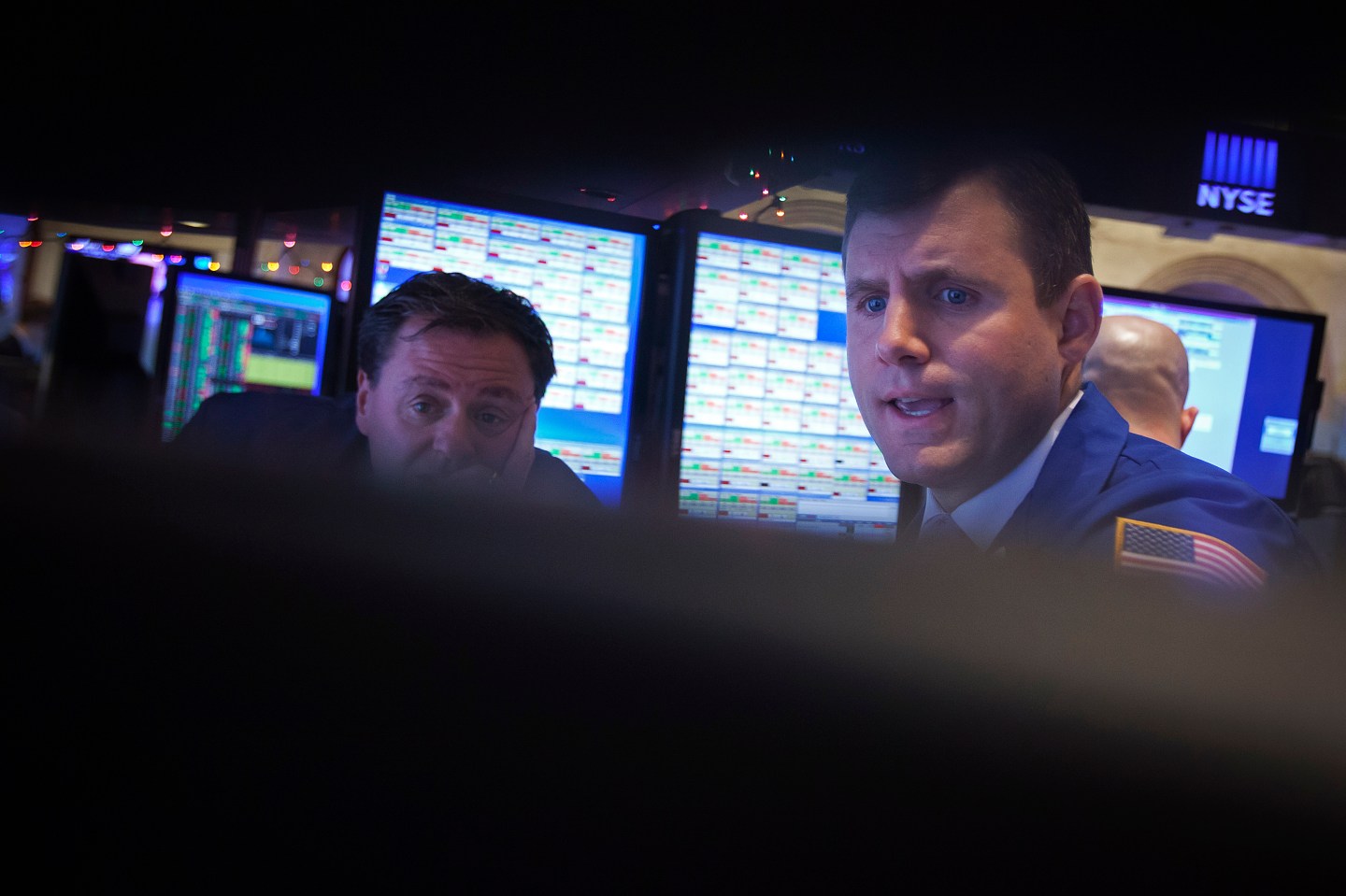 Traders work on the floor of the NYSE in New York