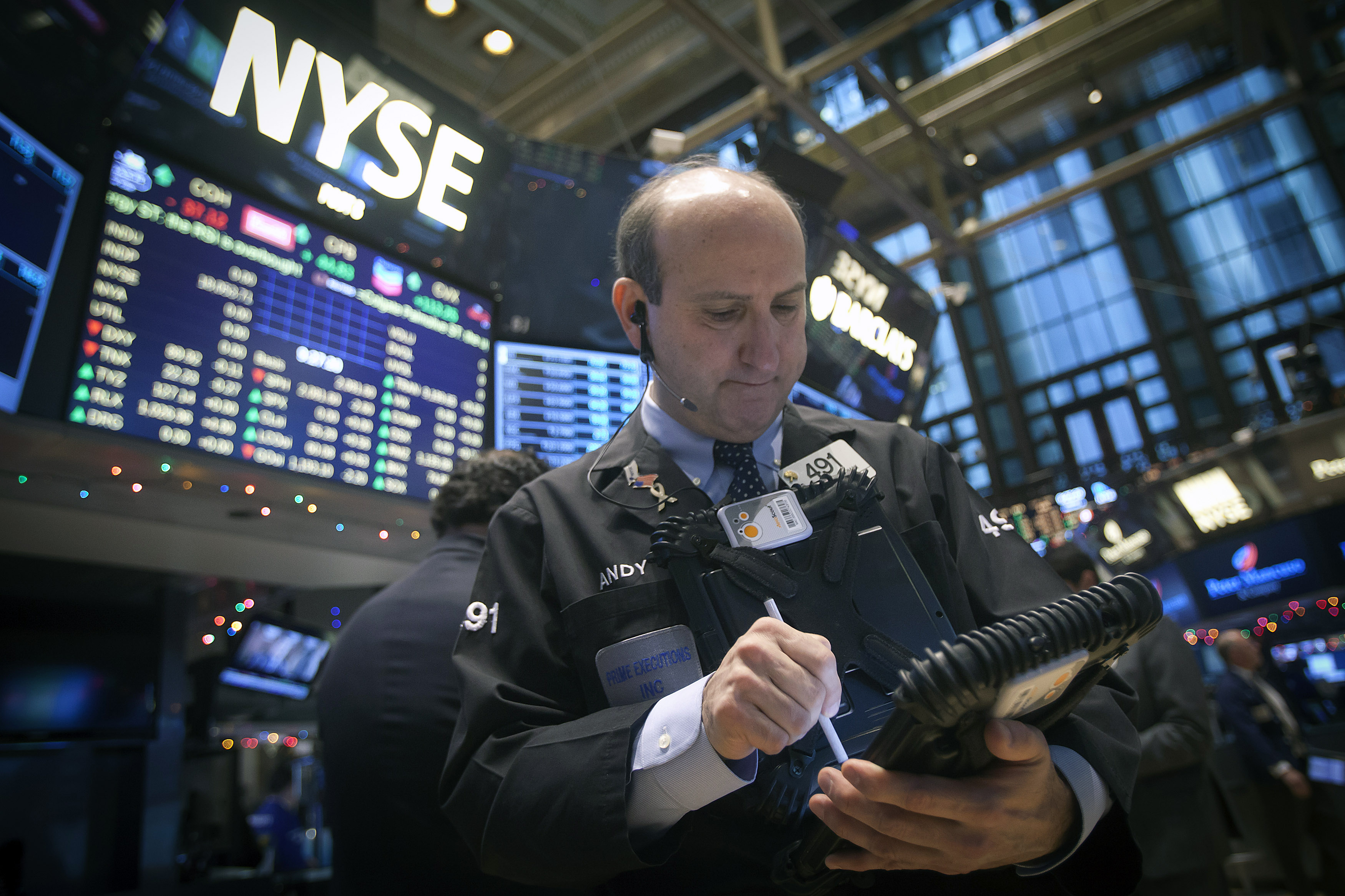 Traders work on the floor of the NYSE in New York