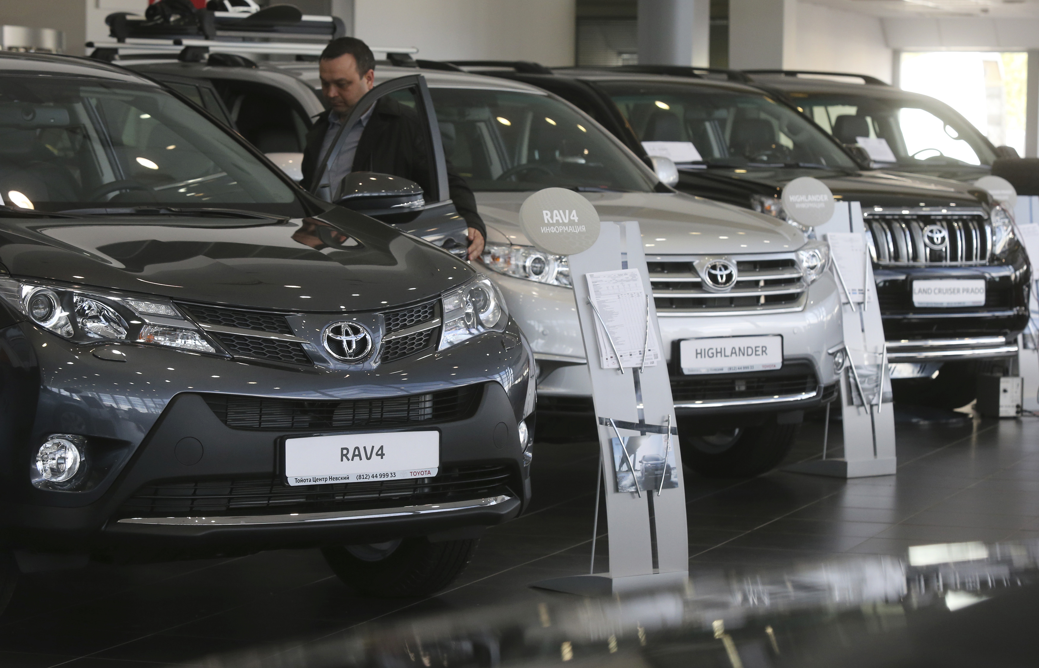 Automobiles are on display at a Toyota car sales and show room in St. Petersburg