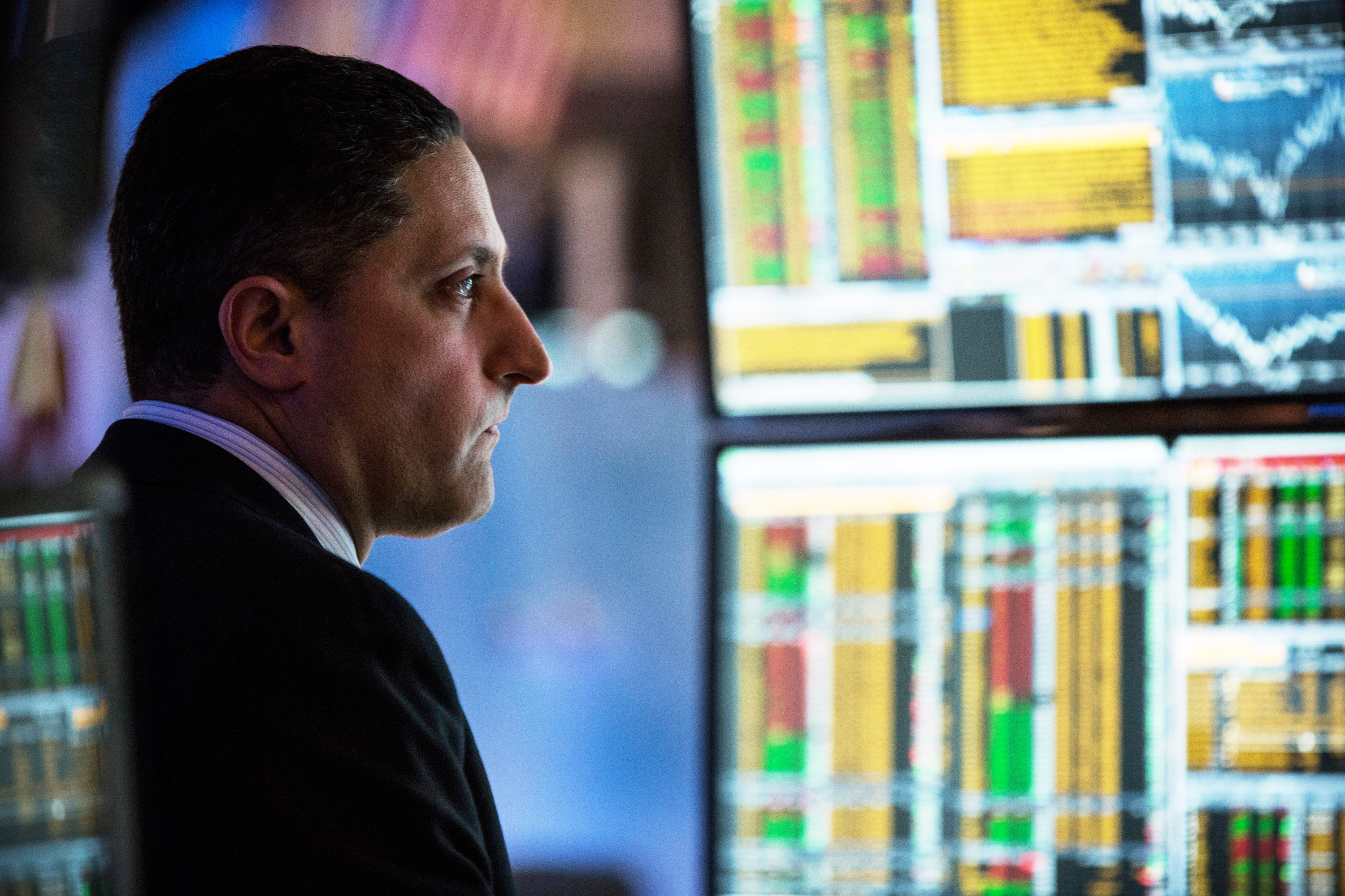 NEW YORK, NY - JANUARY 20: A trader works on the floor of the New York Stock Exchange during the afternoon of January 20, 2015 in New York City. The market closed largely unchanged from the beginning of the day. (Photo by Andrew Burton/Getty Images)