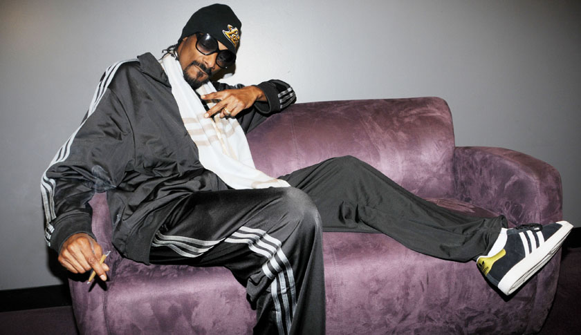 WHAT' S THAT YOUR SMOKING SNOOP? Rapper Snoop Dogg is spotted smoking a suspicious looking cigarette backstage at the Nokia Theatre in Los Angeles
