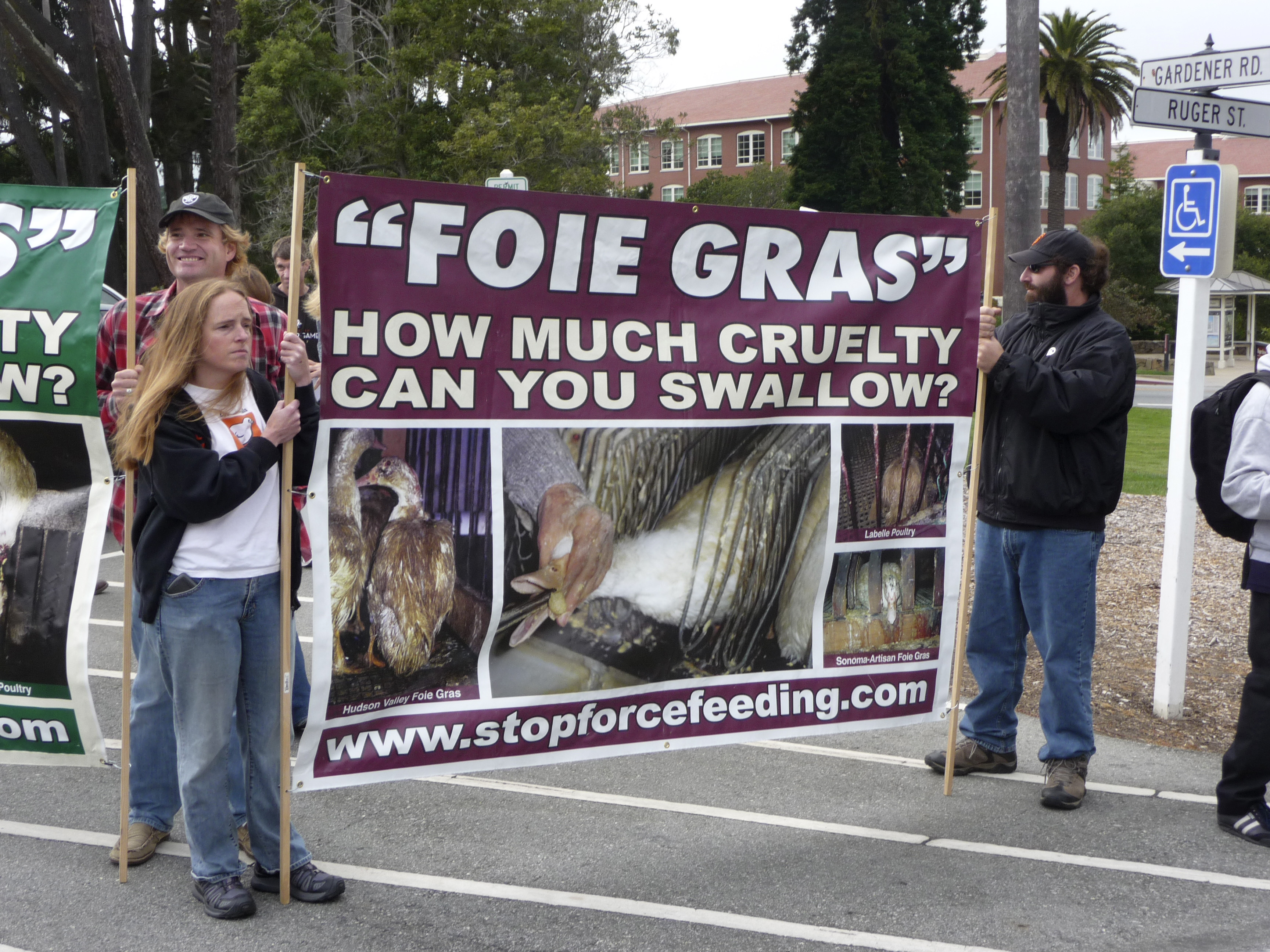 Animal rights activists protest the Presidio Social Club restaurant's decision to serve foie gras in San Francisco