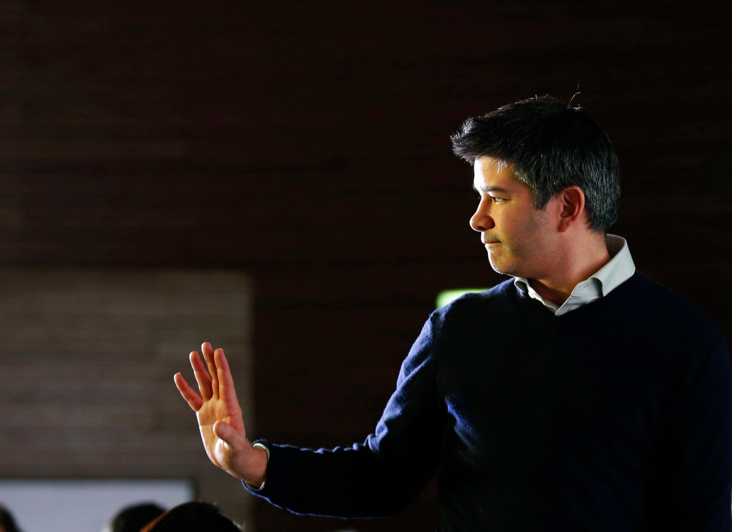 Uber CEO Kalanick acknowledges attendees during the Baidu and Uber strategic cooperation and investment signing ceremony in Beijing