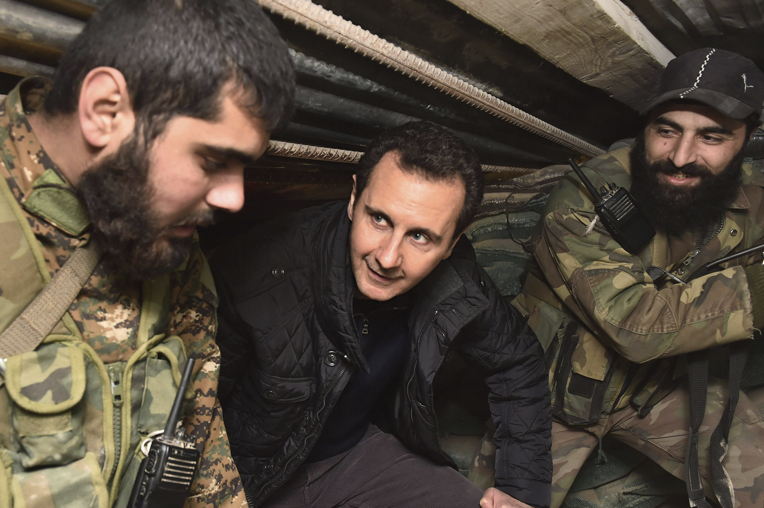 Syrian President Bashar al-Assad talks to soldiers during his visit to Jobar, northeast of Damascus