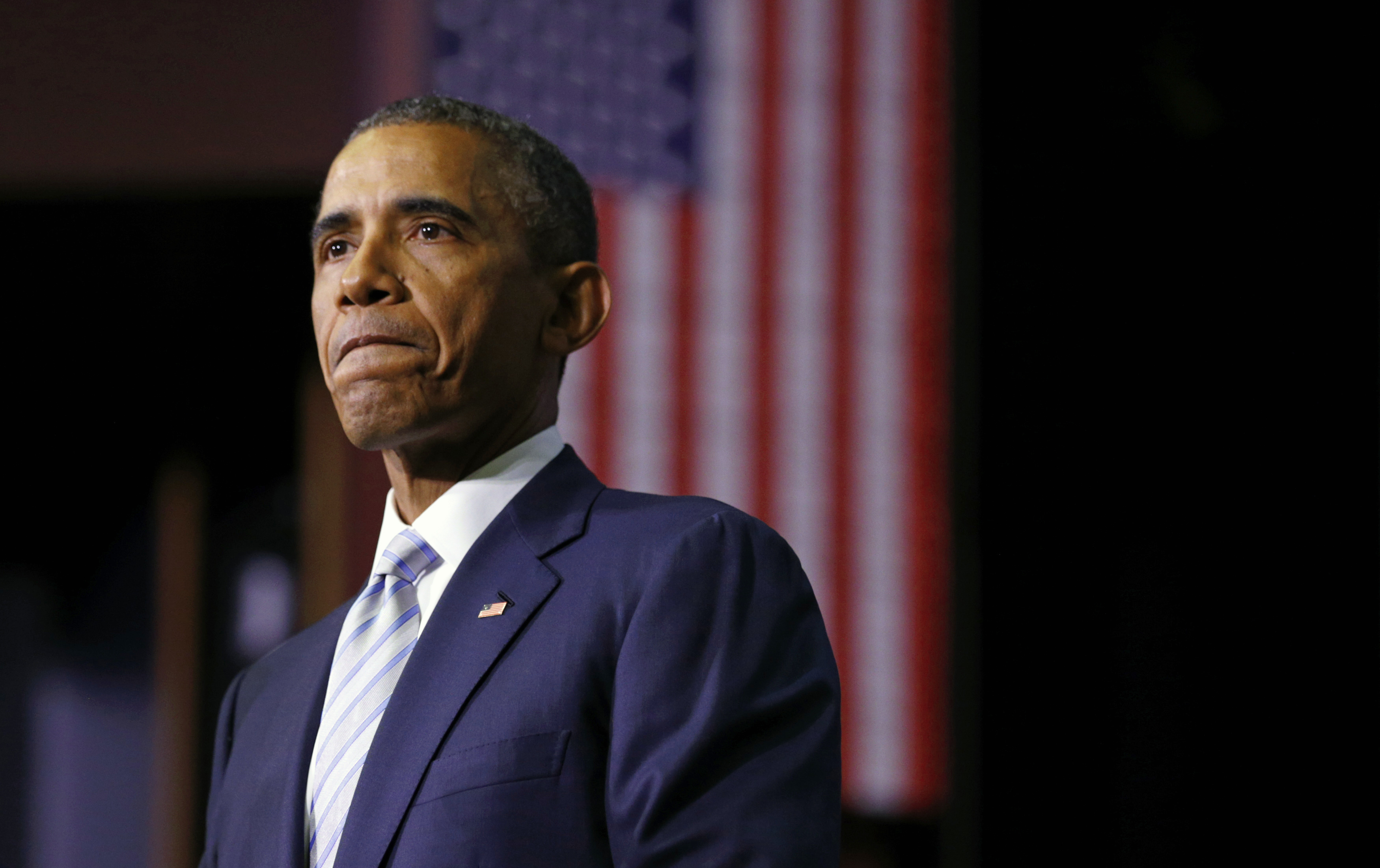 Obama pauses while speaking about college cost initiatives during a visit to Pellissippi State College in Knoxville