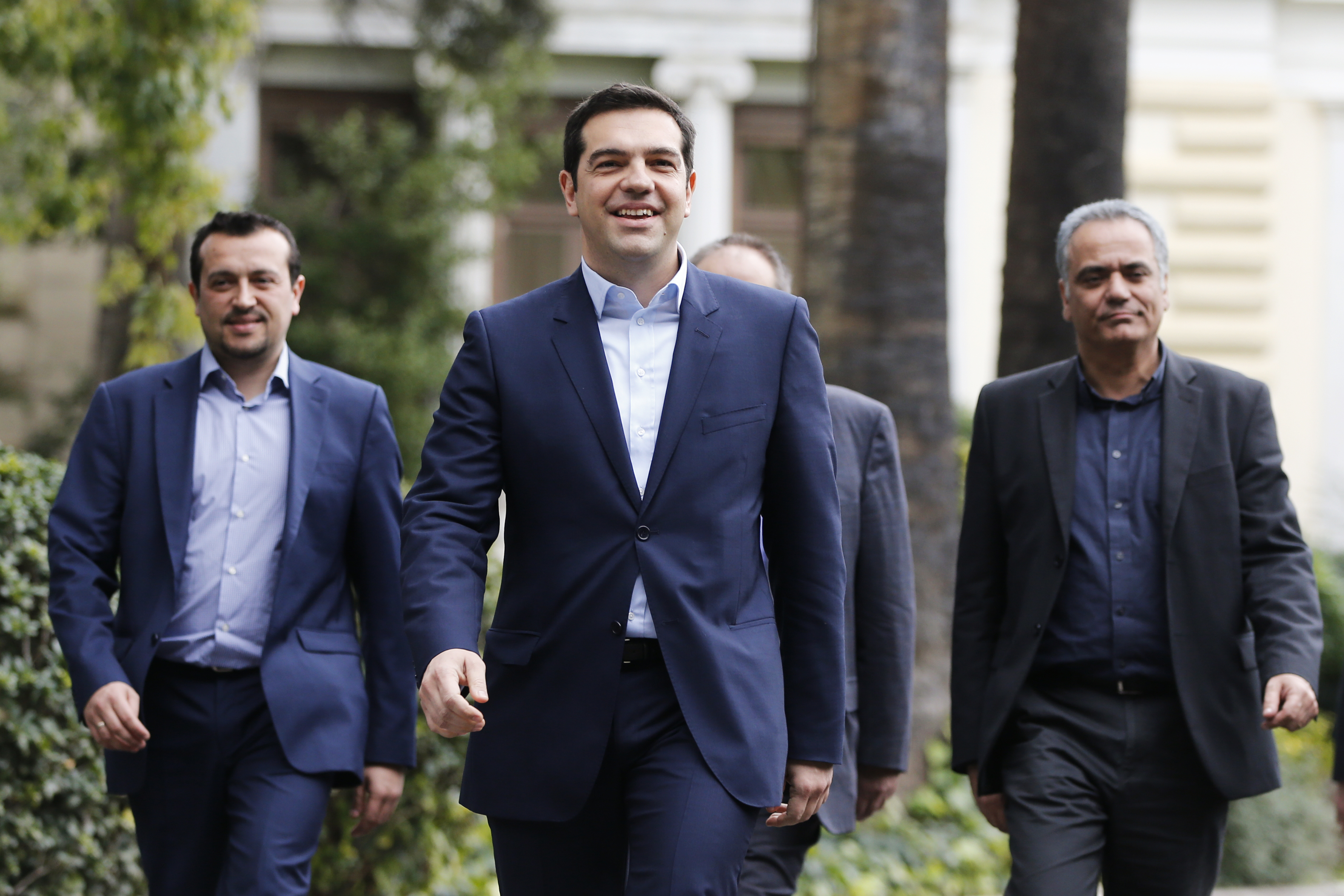 Greece's newly-appointed PM Tsipras leaves the Presidential Mansion after his swearing-in ceremony as Greece's first leftist prime minister in Athens