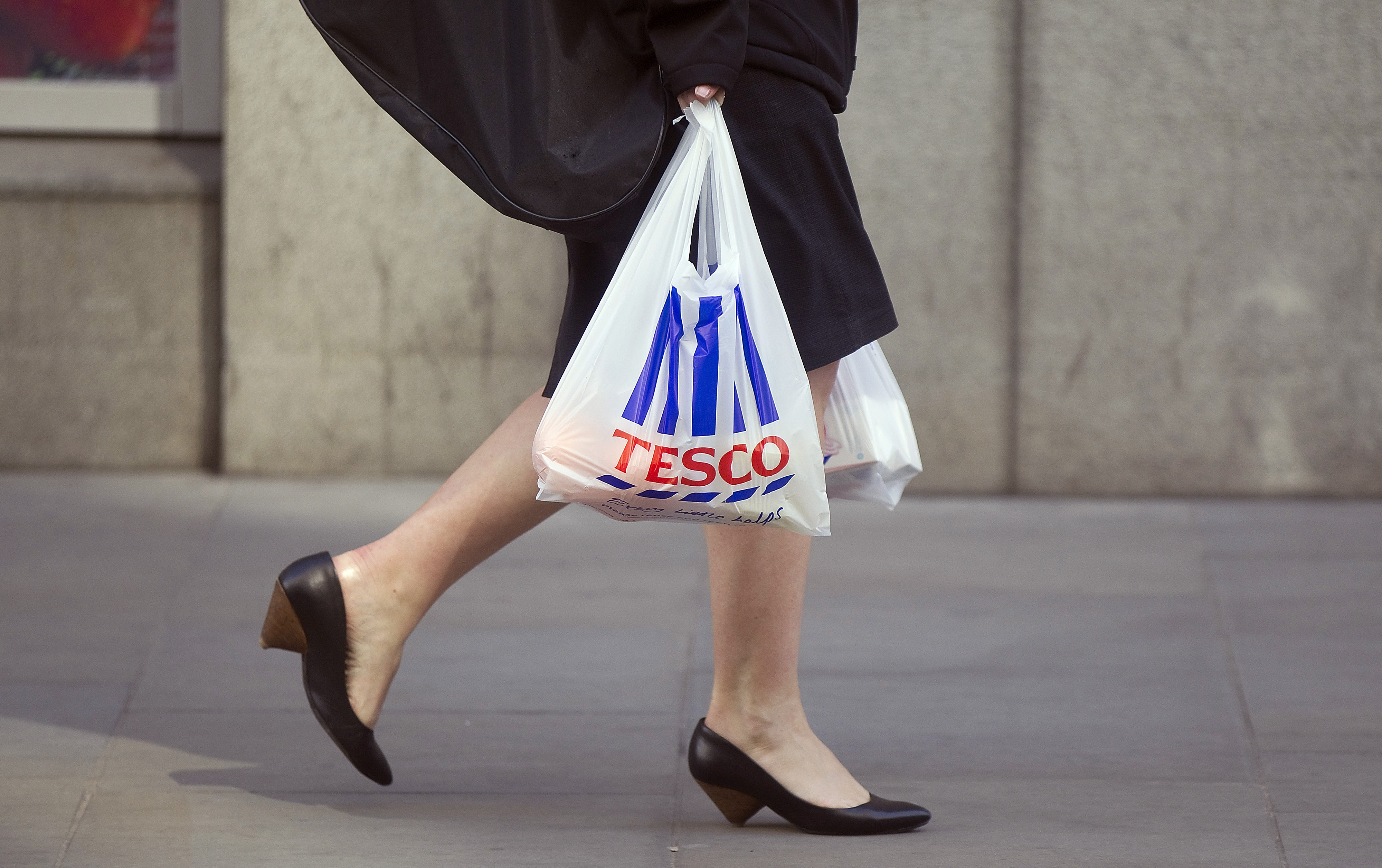 Tesco Plc Metro Stores As U.K. Business Flags