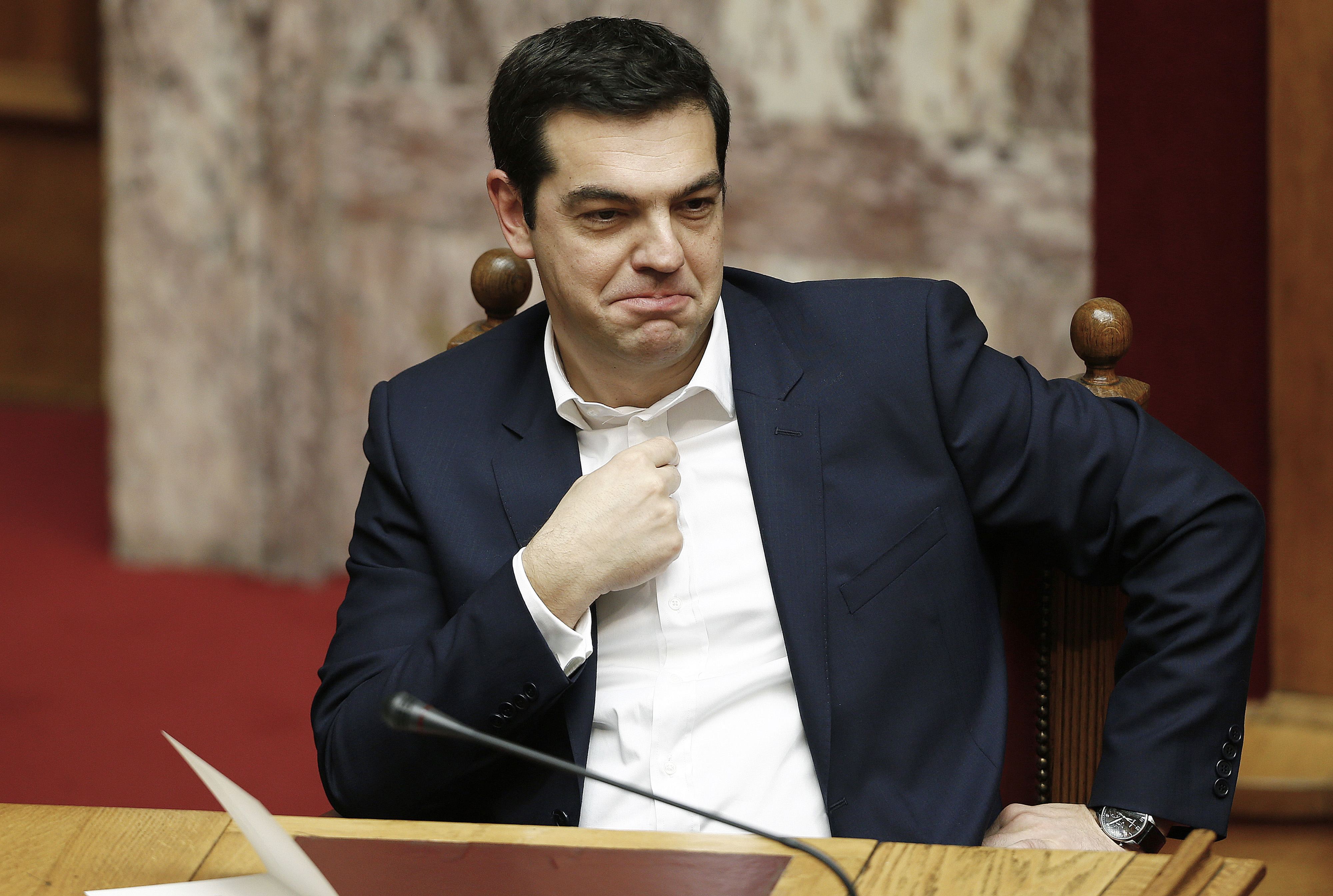 Alexis Tsipras, Greece's prime minister, sits and waits ahead of the swearing-in ceremony for the new government held in the Greek Parliament building in Athens, Greece, on Thursday, Feb. 5, 2015. Greece held fast to demands to roll back austerity as the European Central Bank turned up the heat before Finance Minister Yanis Varoufakis was to meet one of his main antagonists, German counterpart Wolfgang Schaeuble. Photographer: Yannis Behrakis/Pool via Bloomberg *** Local Caption *** Alexis Tsipras