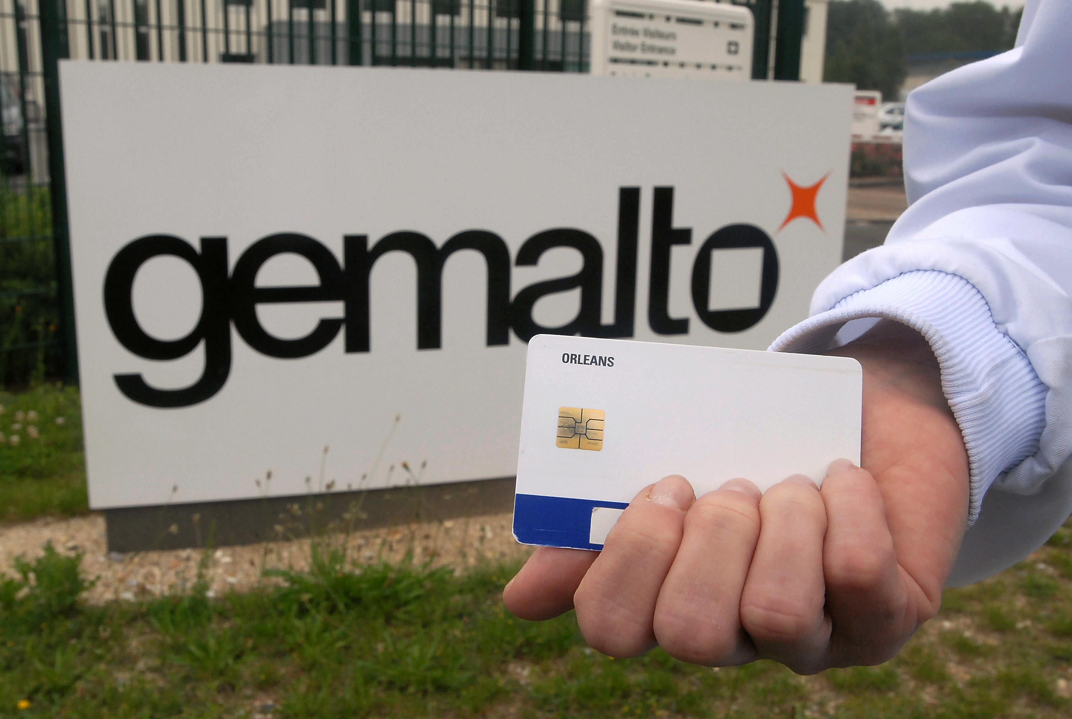 A man shows a process card in front of t