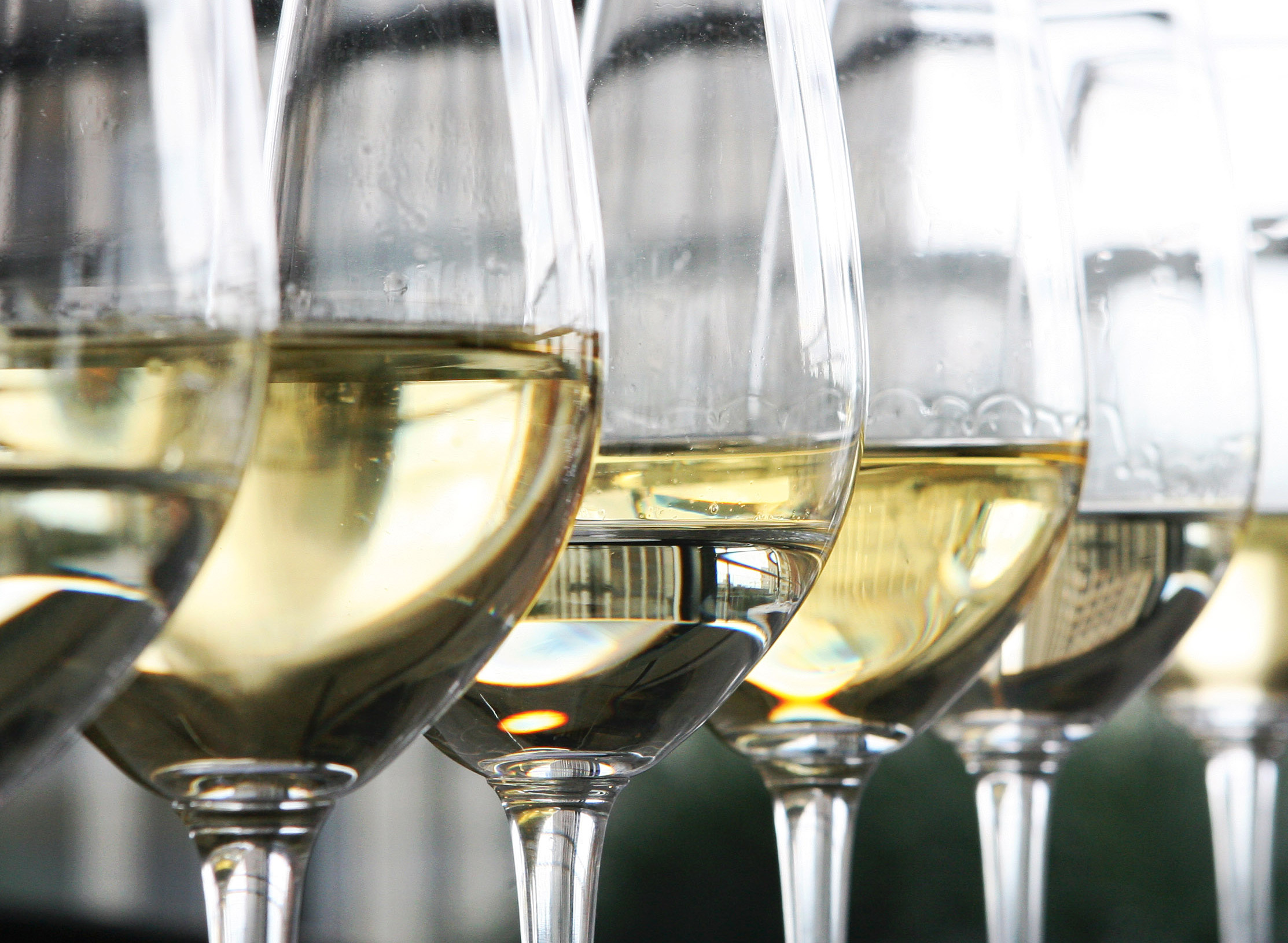 Glasses of white wine sit on display at a restaurant in Lond