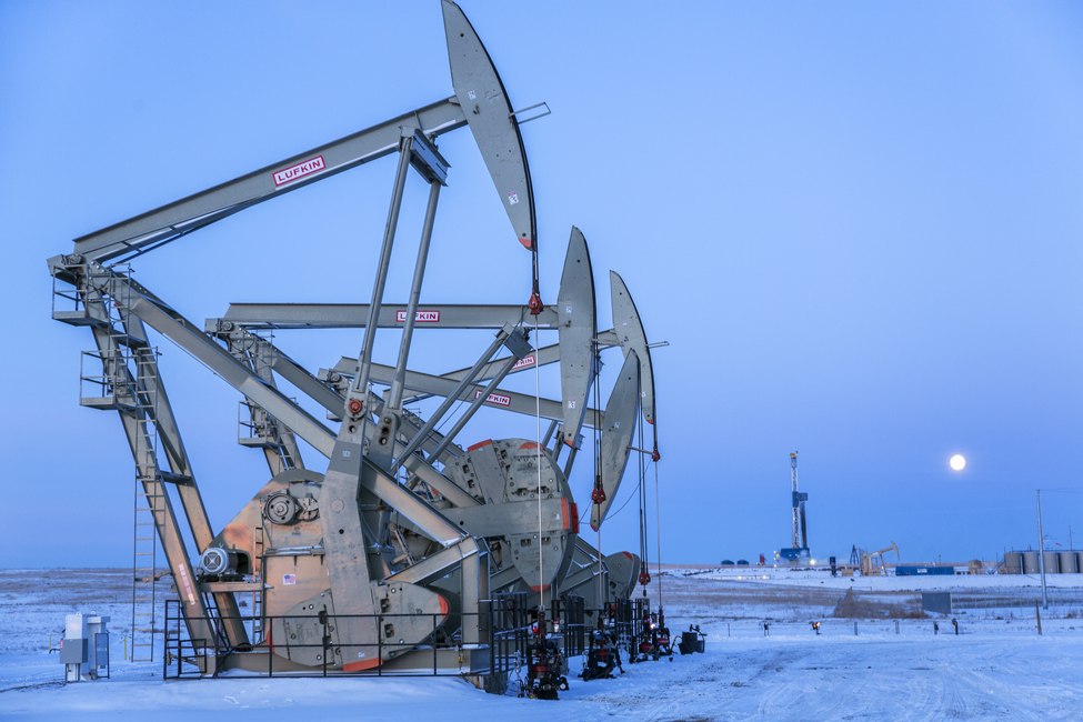 New pump jacks bringing up sweet crude oil from the Bakken shale deposits in the Williston Basin, some ten miles north of Williston, ND. This drilling pad is on the Smith Farm, and is managed by Statoil.