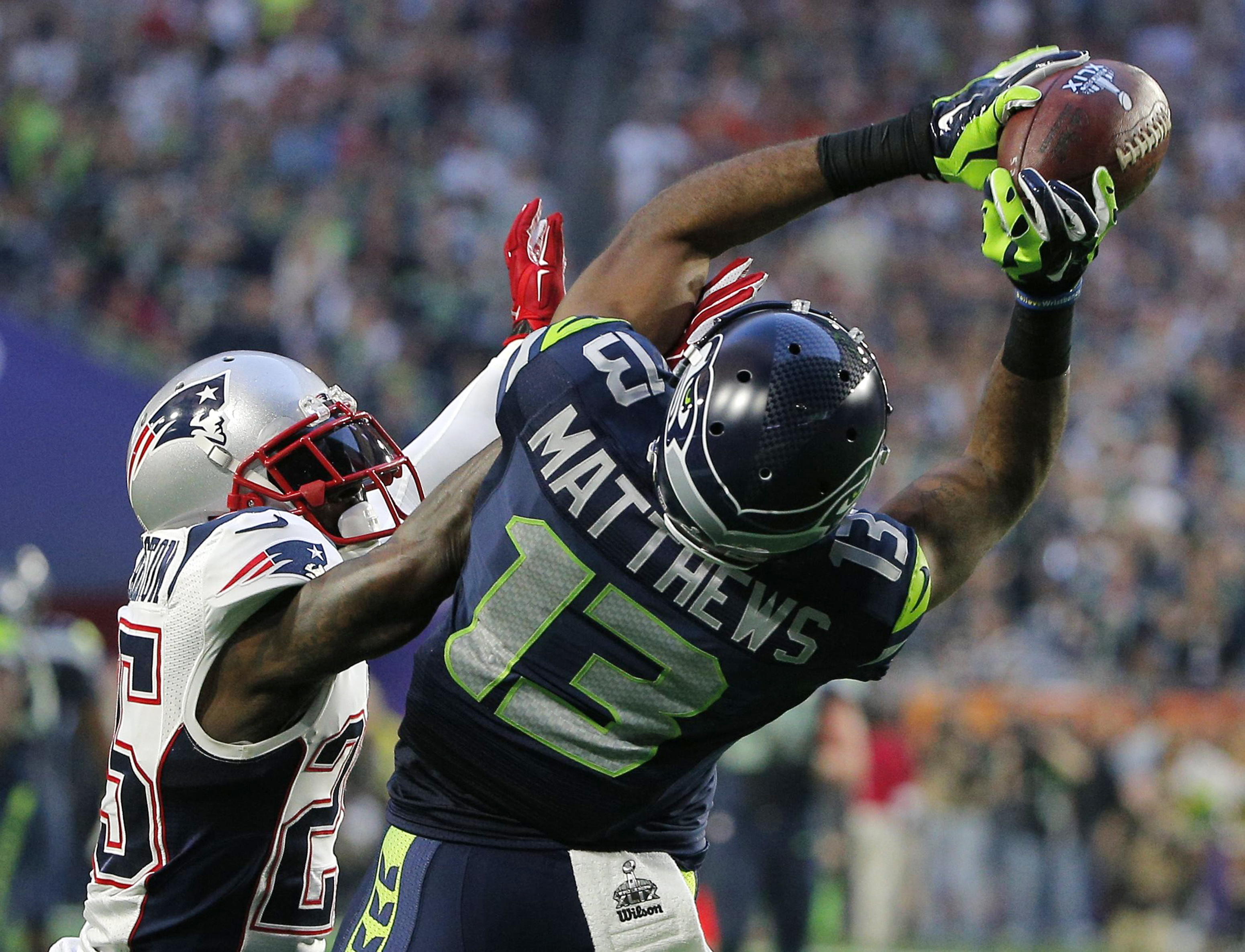 Seattle Seahawks wide receiver Matthews catches a pass against New England Patriots cornerback Arrington in the second quarter during the NFL Super Bowl XLIX football game in Glendale