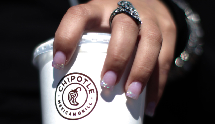 A girl holds a drink from Chipotle Mexican Grill restaurant in Redlands