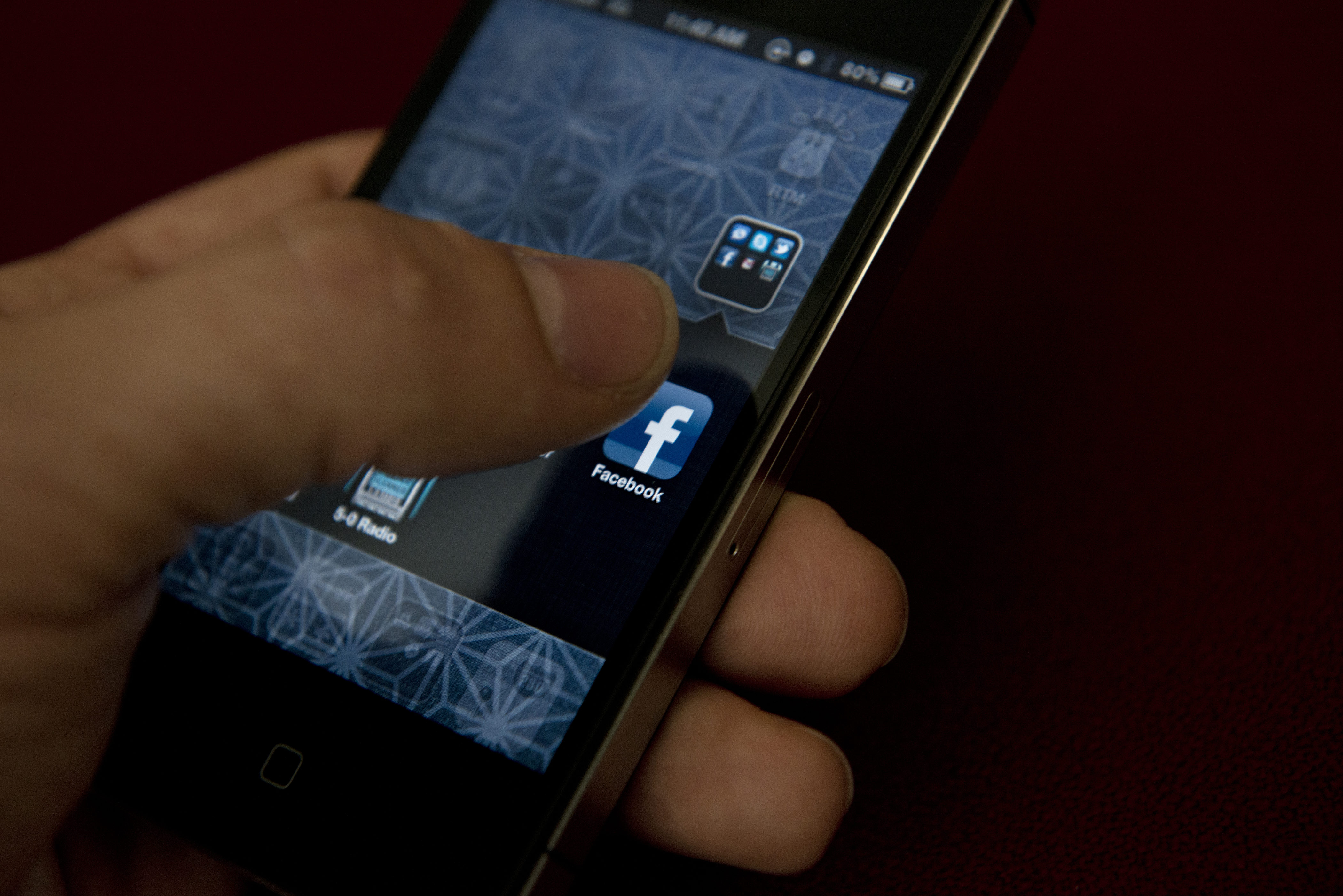 An Apple iPhone displays Facebook's messaging app on May 10, 2012 in Washington, DC.  