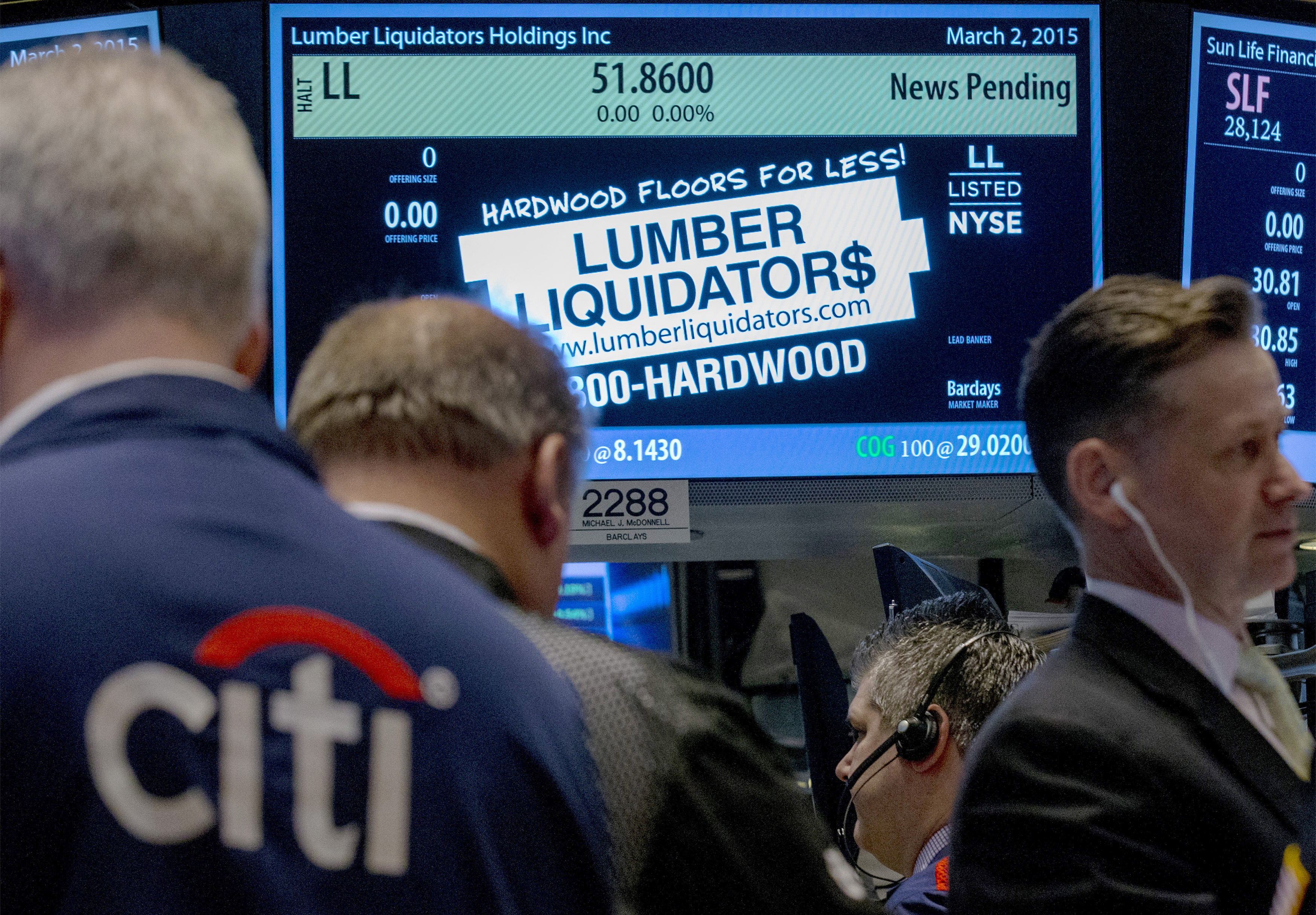 Traders wait for shares of Lumber Liquidators to begin trading on the floor of the New York Stock Exchange