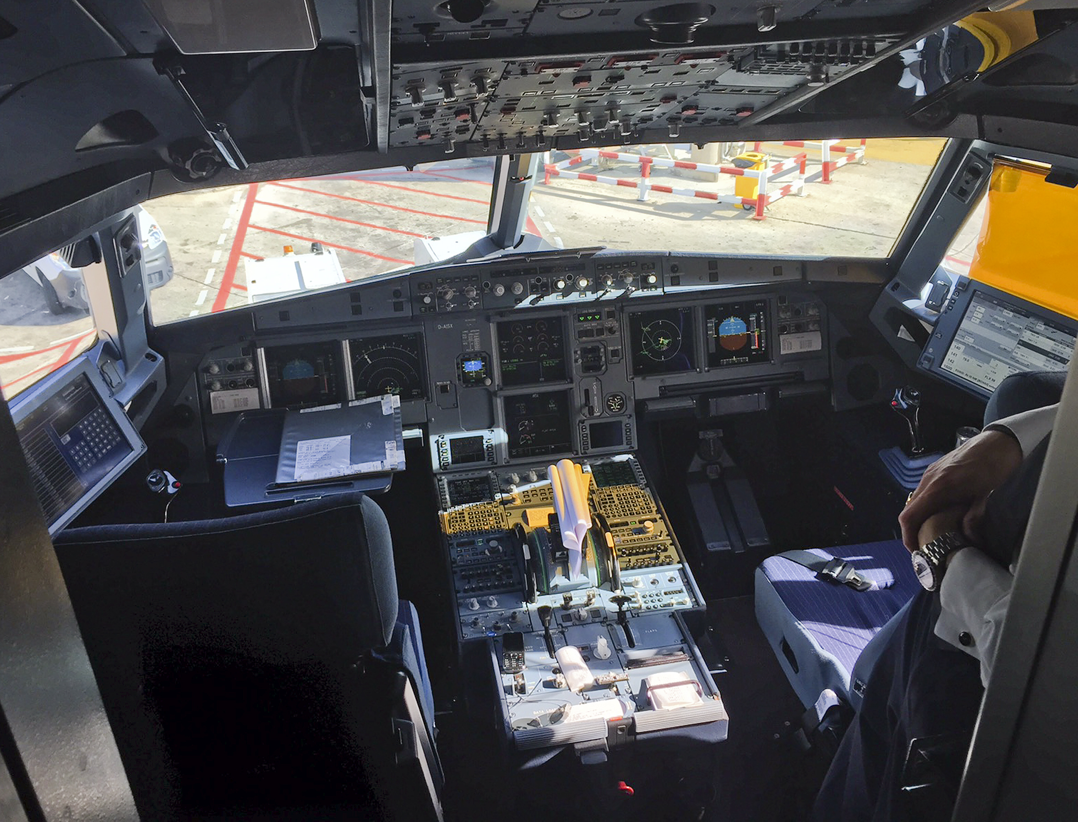 A pilot stands inside the cockpit of Airbus A321 during boarding in Barcelona