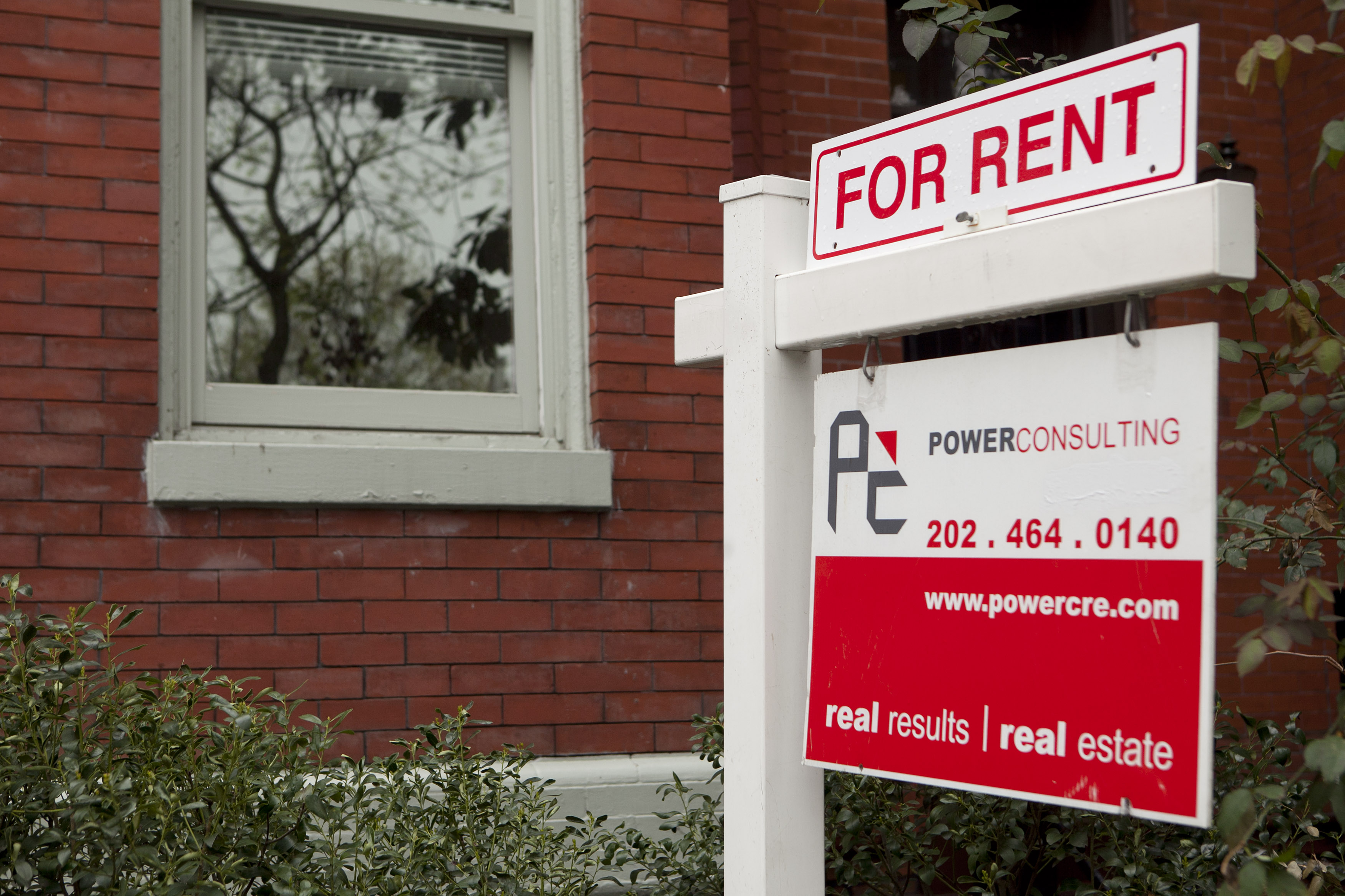 A rent sign stands in front of a row house in the Logan Circle neighborhood of Washington, D.C.