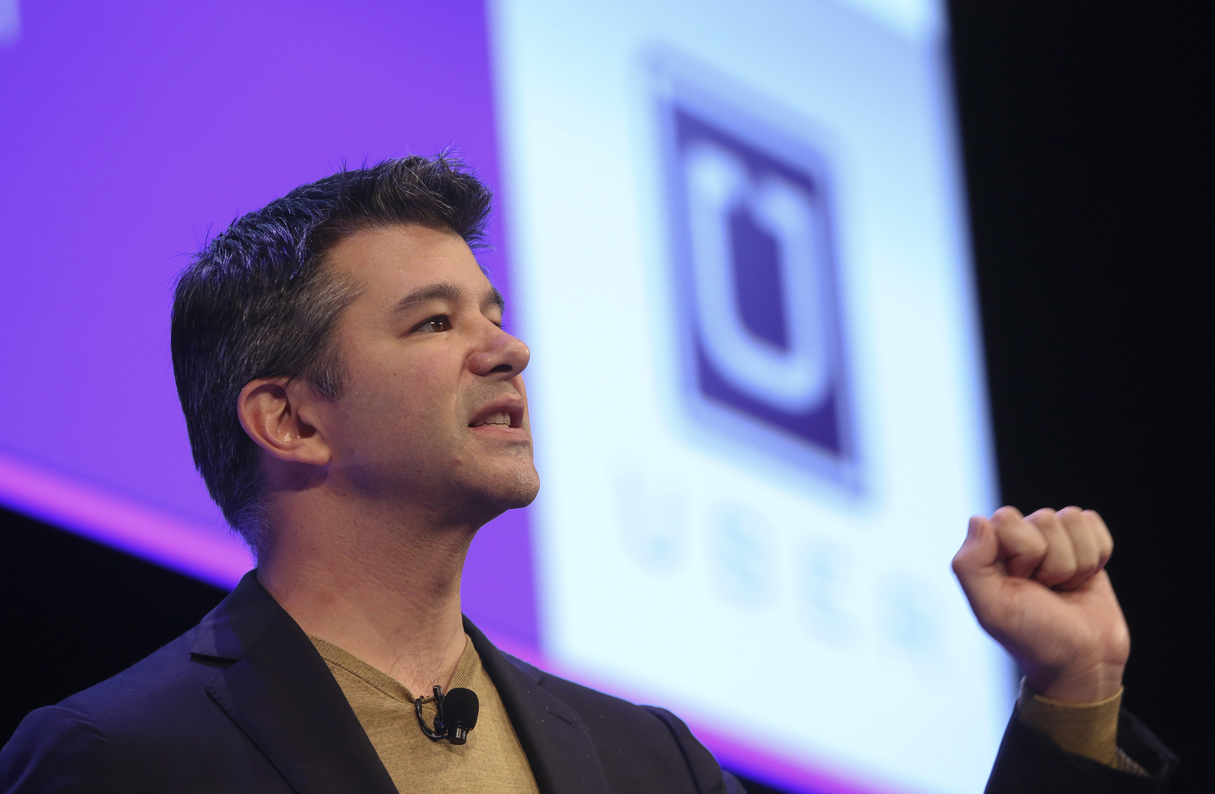 Travis Kalanick, chief executive officer of Uber Technologies Inc., speaks during the Institute of Directors (IOD) annual convention at the Royal Albert Hall in London, U.K., on Friday, Oct. 3, 2014. U.K. Chancellor of the Exchequer George Osborne told the IOD "clearly the economy is growing, unemployment has fallen sharply and business investment has picked up," Photographer: Chris Ratcliffe/Bloomberg via Getty Images