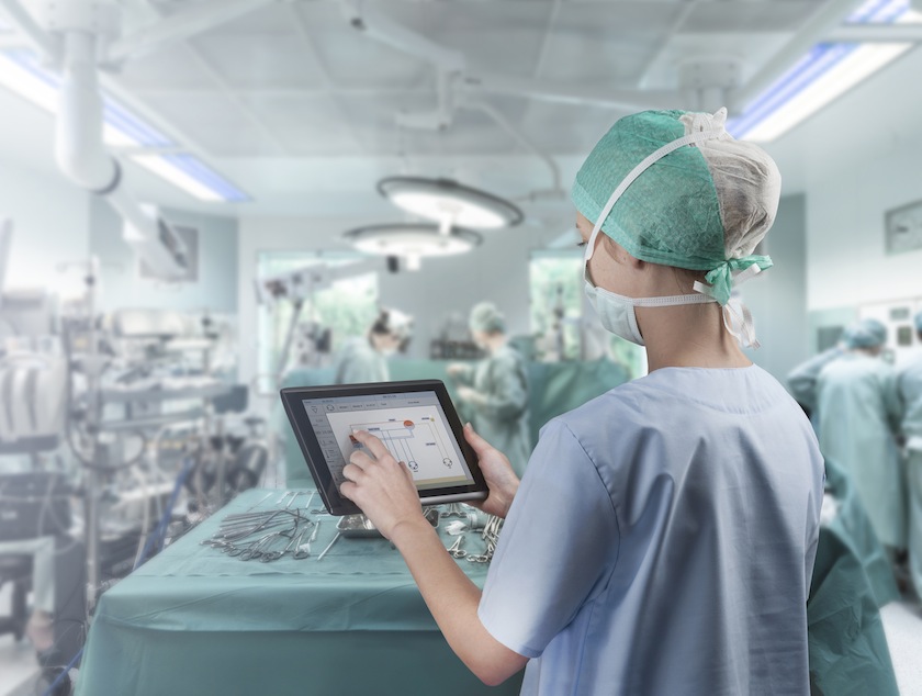 Surgeon using tablet
