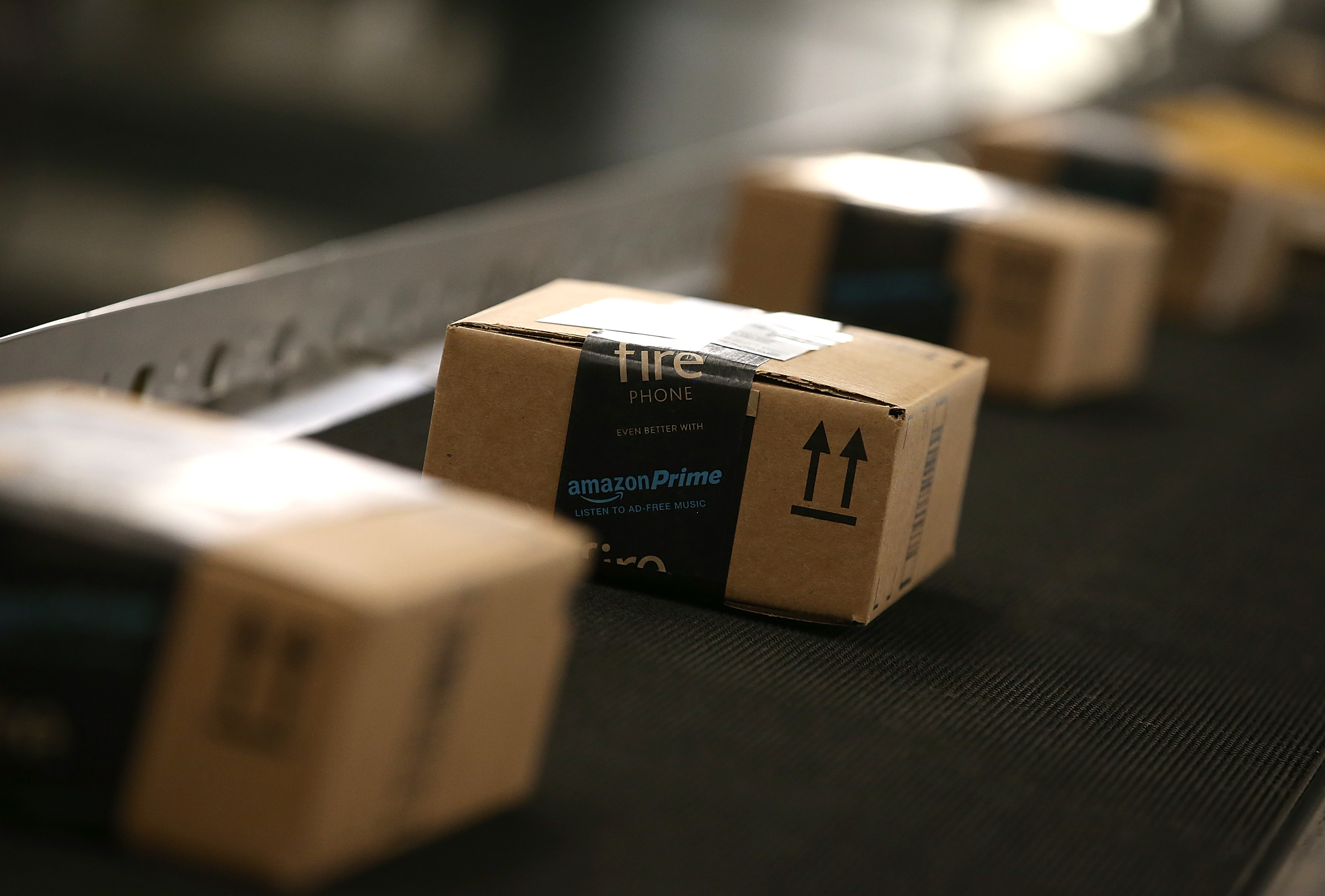 Boxes move along a conveyor belt at an Amazon fulfillment center in Tracy, California.