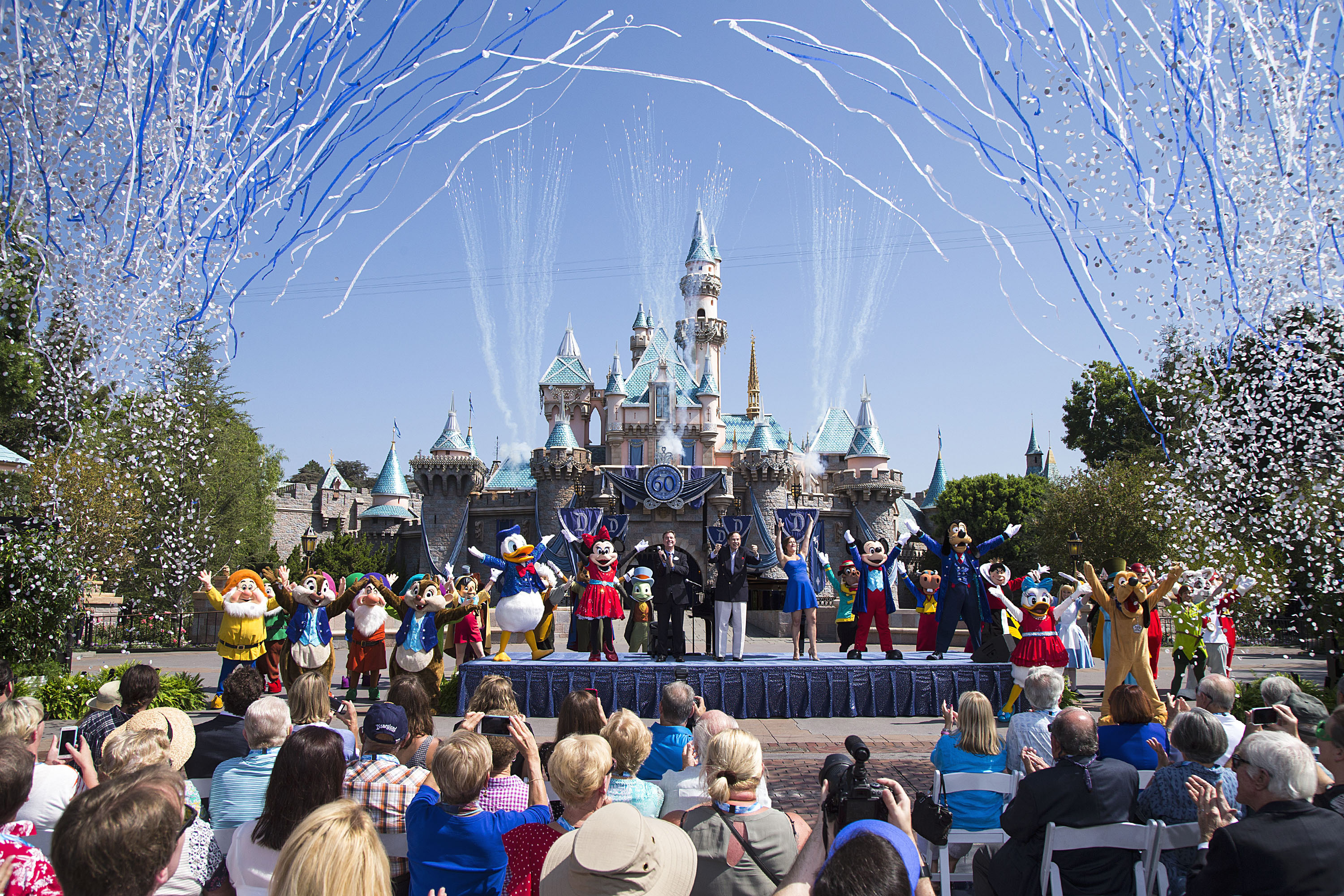 (July 17, 2015) Ð Mickey Mouse and his friends celebrate the 60th anniversary of Disneyland park during a ceremony at Sleeping Beauty Castle featuring Academy Award-winning composer, Richard Sherman and Broadway actress and singer Ashley Brown, in Anaheim, Calif. on Friday, July 17. Celebrating six decades of magic, the Disneyland Resort Diamond Celebration features three new nighttime spectaculars that immerse guests in the worlds of Disney stories like never before with "Paint the Night," the first all-LED parade at the resort; "Disneyland Forever," a reinvention of classic fireworks that adds projections to pyrotechnics to transform the park experience; and a moving new version of "World of Color" that celebrates Walt DisneyÕs dream for Disneyland. (Paul Hiffmeyer/Disneyland Resort)