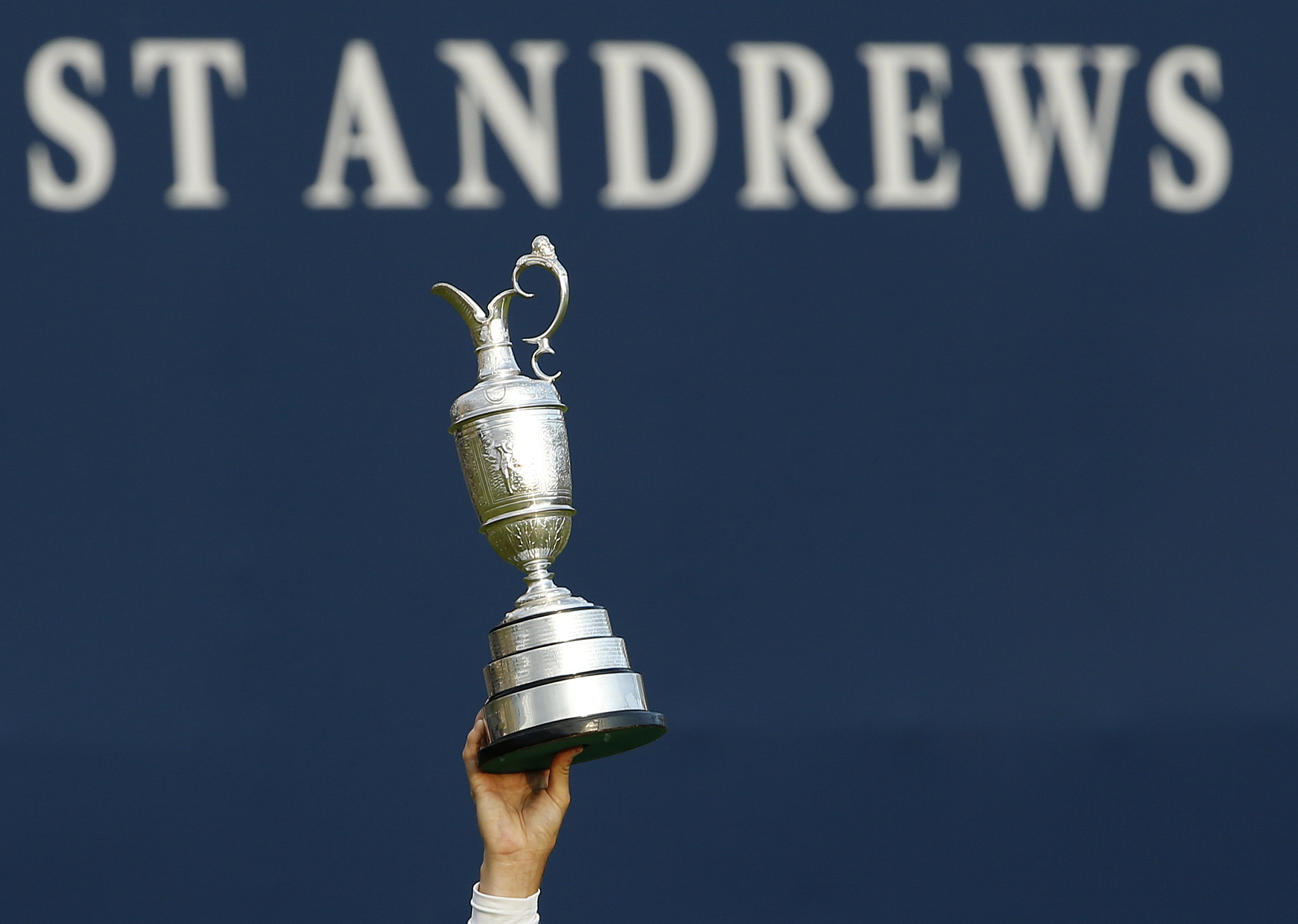 Johnson of the U.S. celebrates as he holds the Claret Jug after winning the British Open golf championship on the Old Course in St. Andrews, Scotland