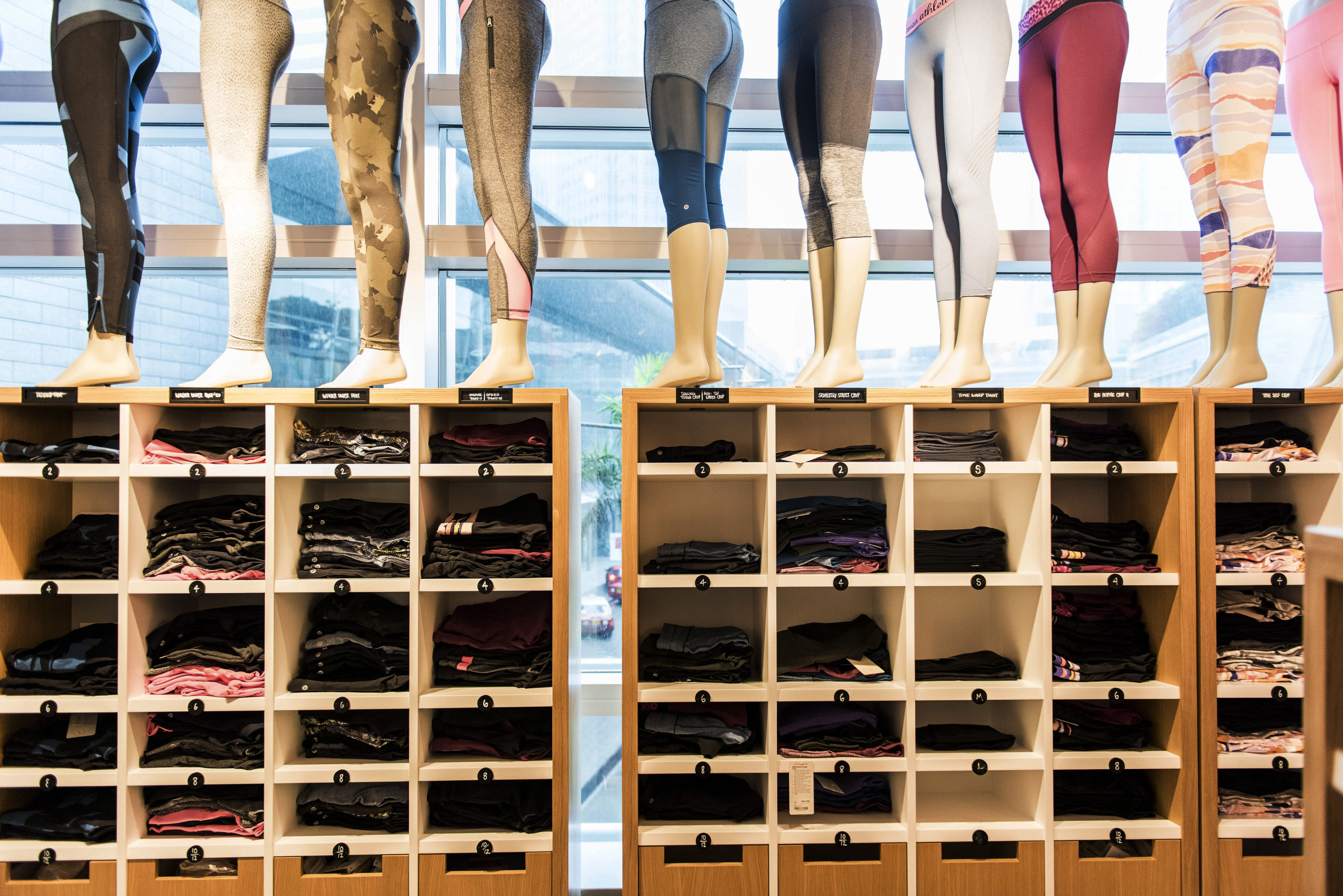 Athletic apparel sits on display inside a Lululemon Athletica Inc. store at International Finance Centre mall in Hong Kong, China, on Monday, June 22, 2015. Lululemon Athletica opened their first retail store in Hong Kong on June 19. Photographer: Xaume Olleros/Bloomberg