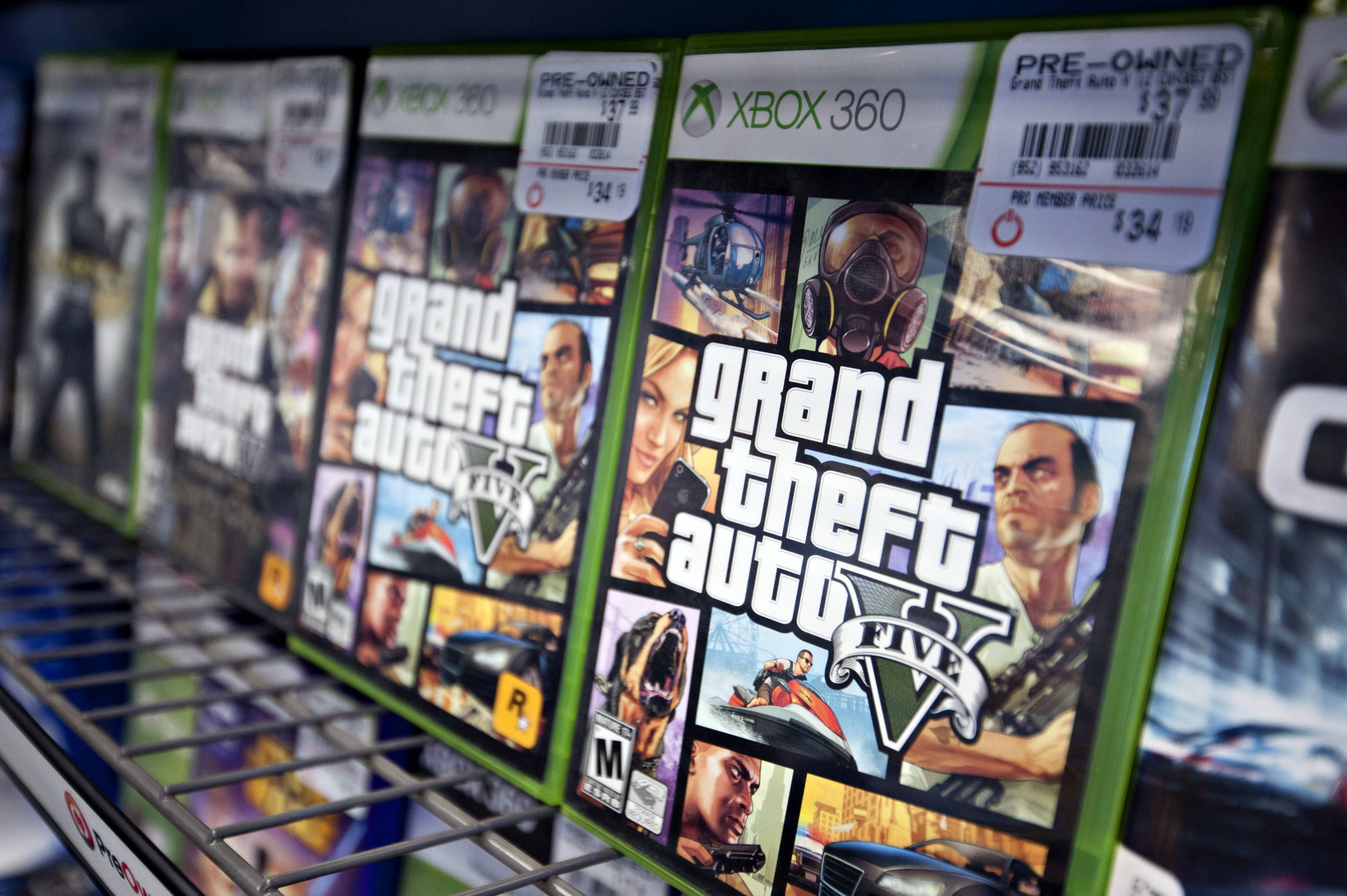 Copies of Take-Two Interactive's "Grand Theft Auto V" for the Microsoft's Xbox 360 game system sit on display for sale at a GameStop Corp. store in Peru, Illinois, U.S.
