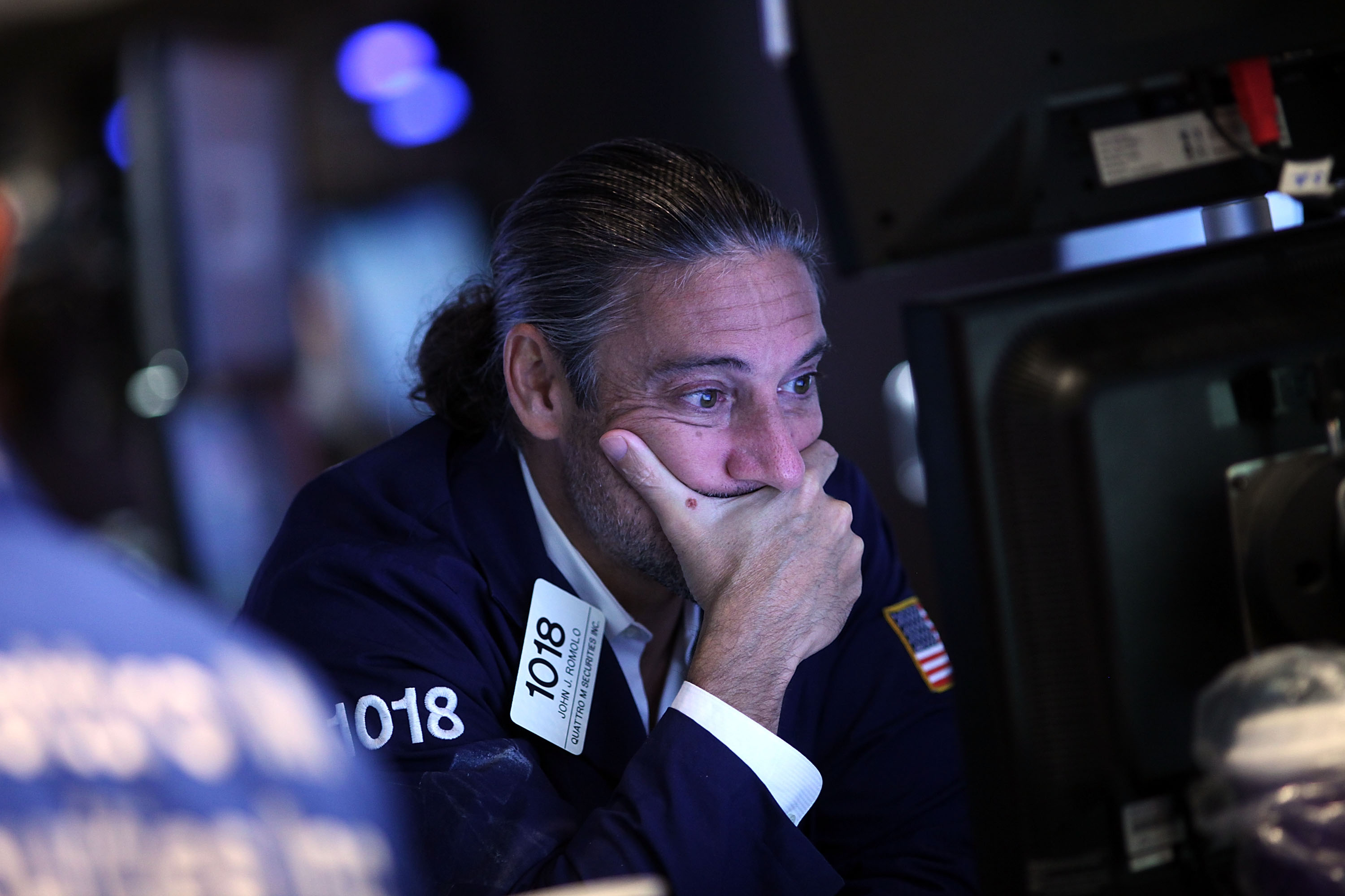 A trader works on the floor of the New York Stock Exchange (NYSE) on August 24, 2015 in New York City.