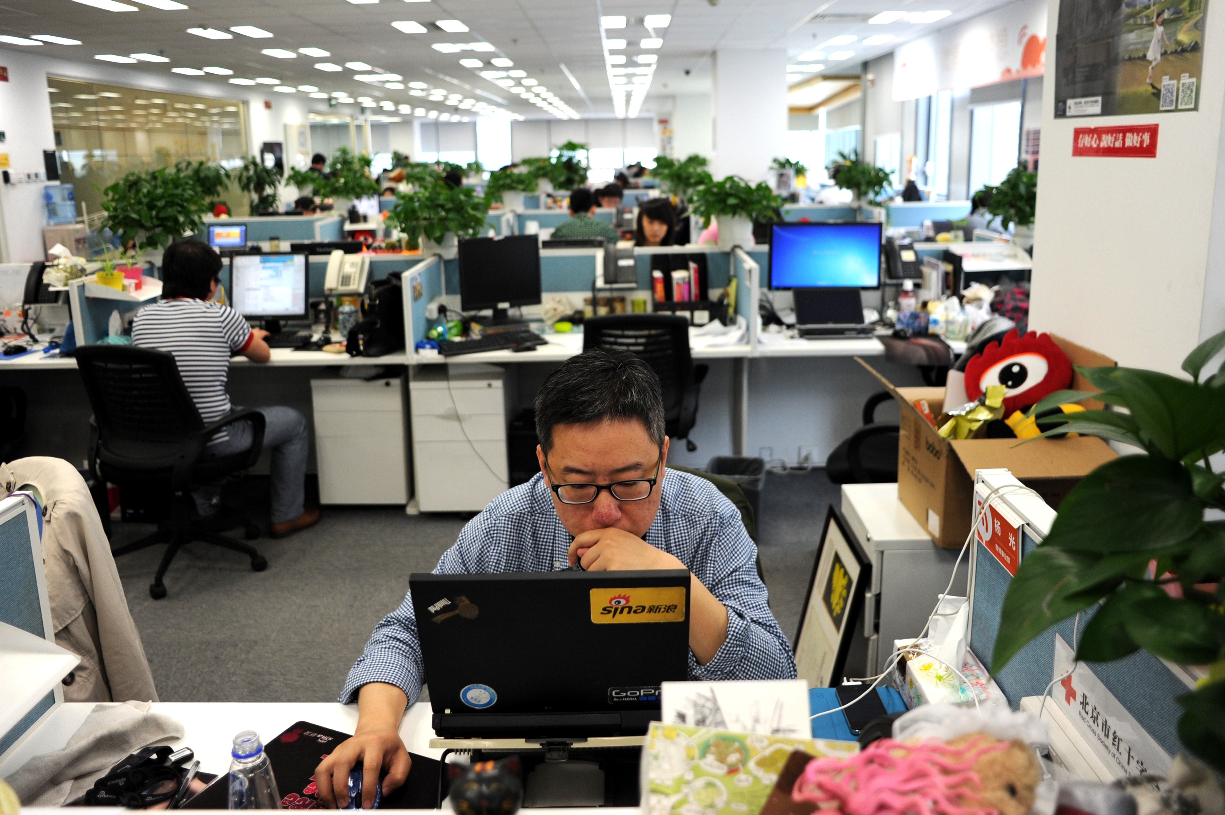 A man using a laptop at an office of Sina Weibo, widely known as China's version of Twitter, in Beijing.