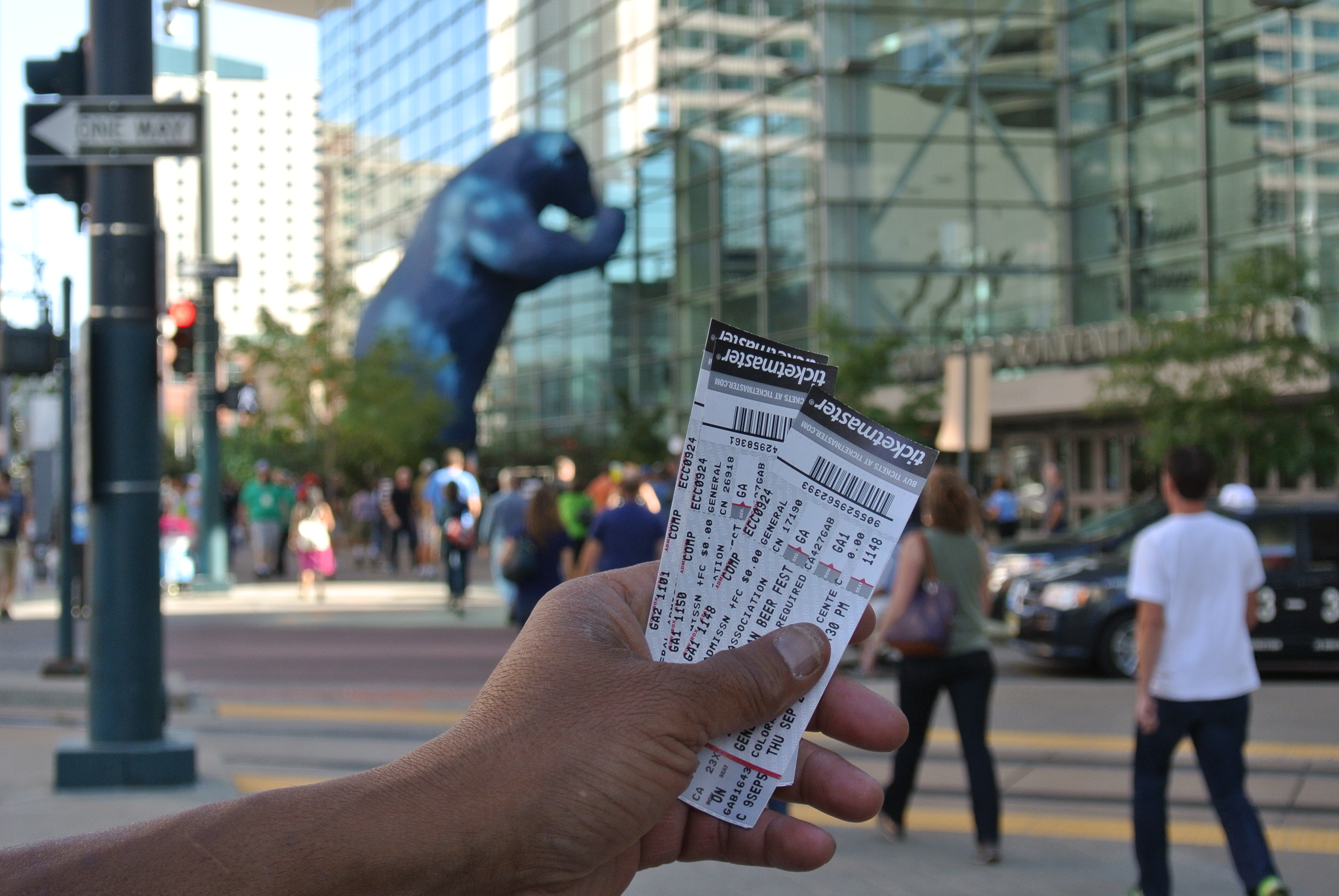 A scalper tries to unload tickets outside of the Great American Beer Festival.