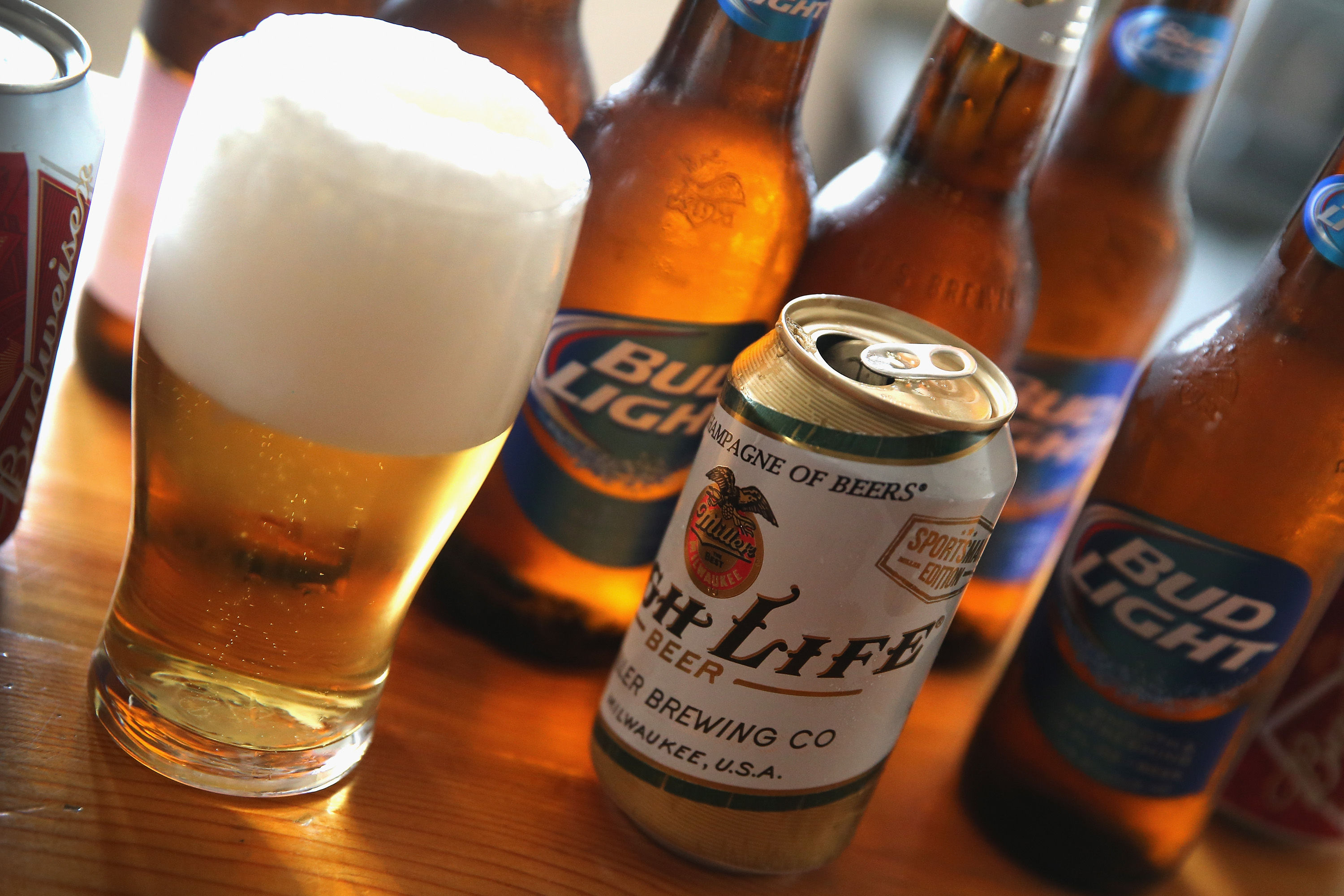 Bottles and cans of beer that are products of SABMiller and Anheuser-Busch InBev are shown on September 15, 2014 in Chicago. Illinois.